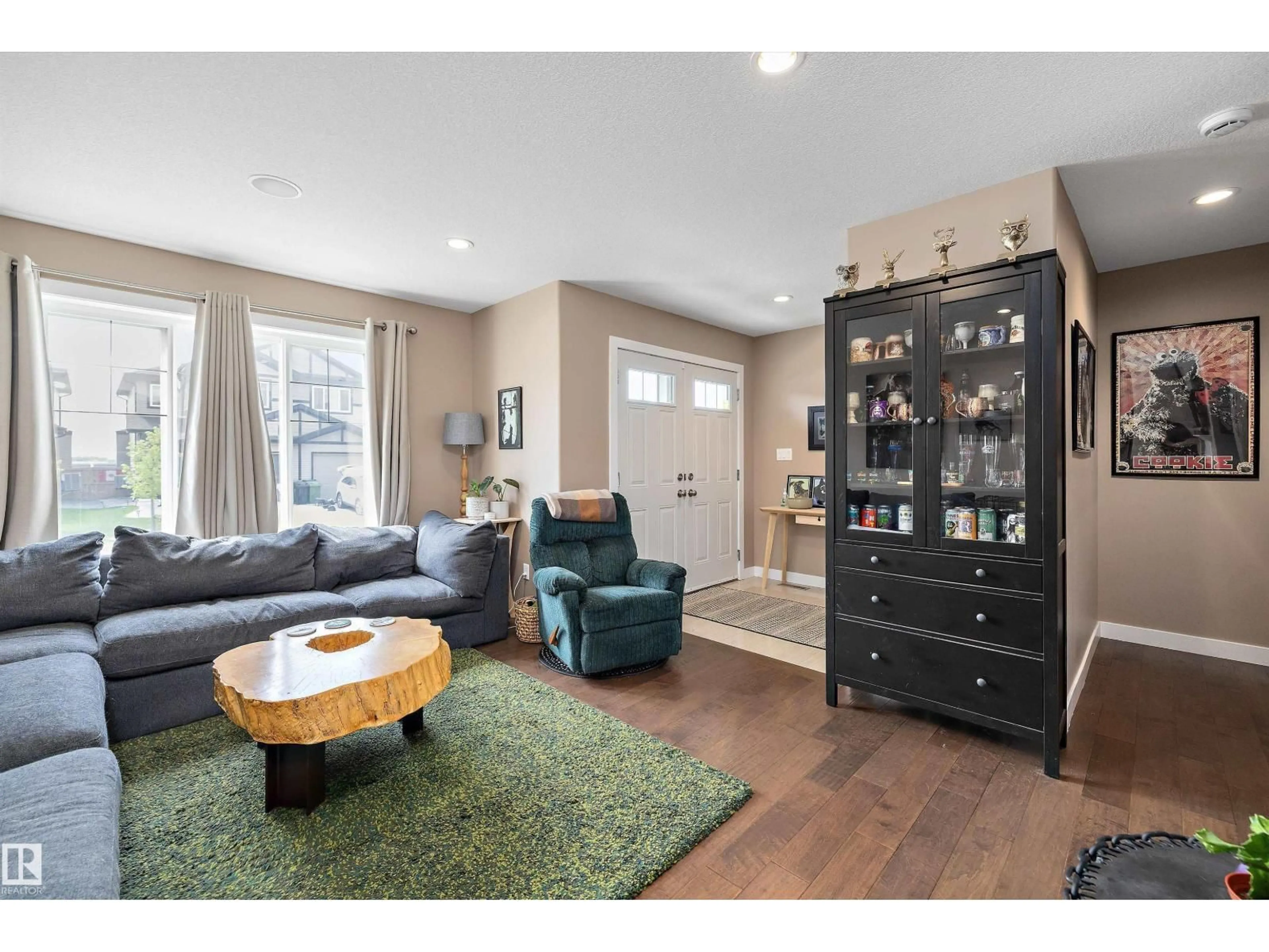Living room with furniture, wood/laminate floor for 102 RICHMOND LI, Fort Saskatchewan Alberta T8L0S6