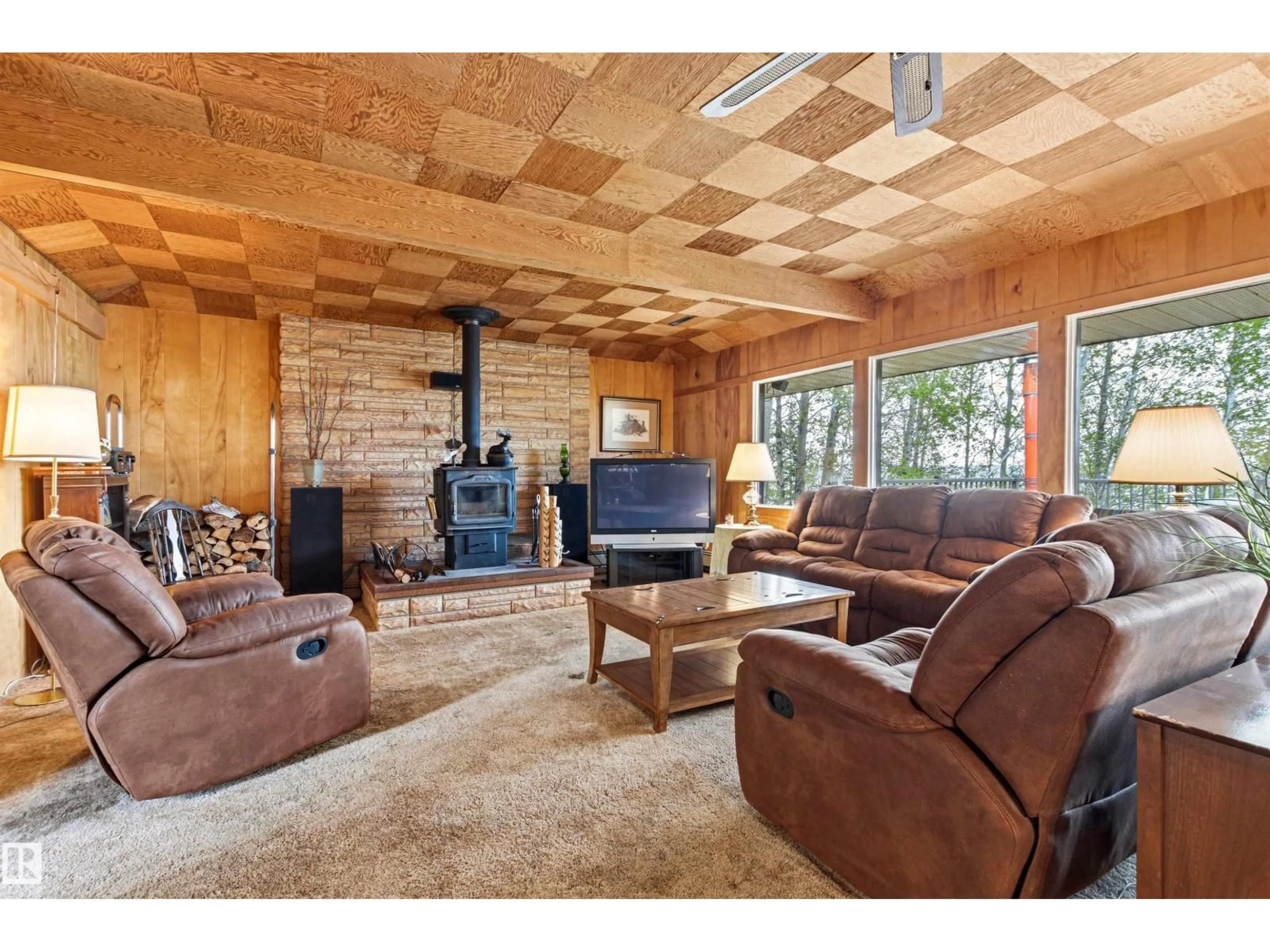 Living room with furniture, wood/laminate floor for 12 53004 RGE ROAD 54 A, Rural Parkland County Alberta T0E2B0