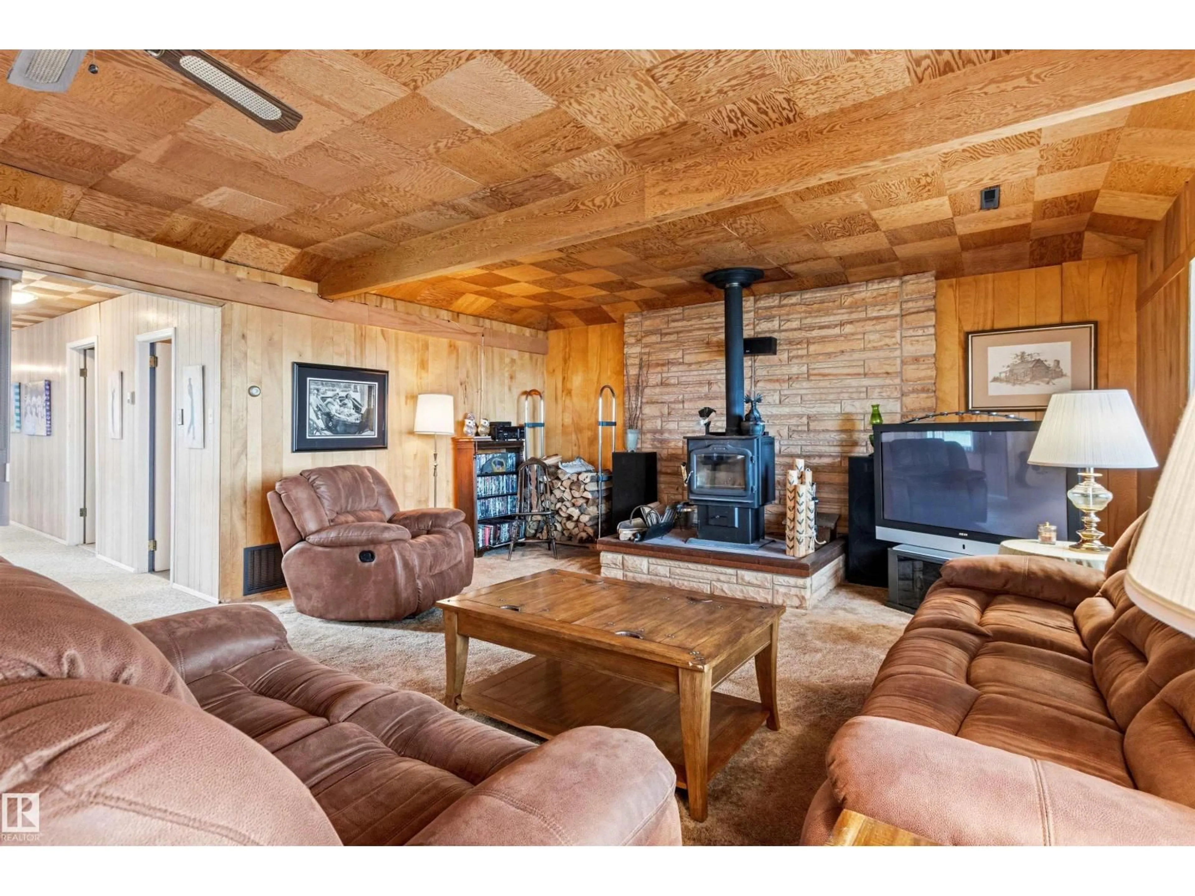 Living room with furniture, wood/laminate floor for 12 53004 RGE ROAD 54 A, Rural Parkland County Alberta T0E2B0