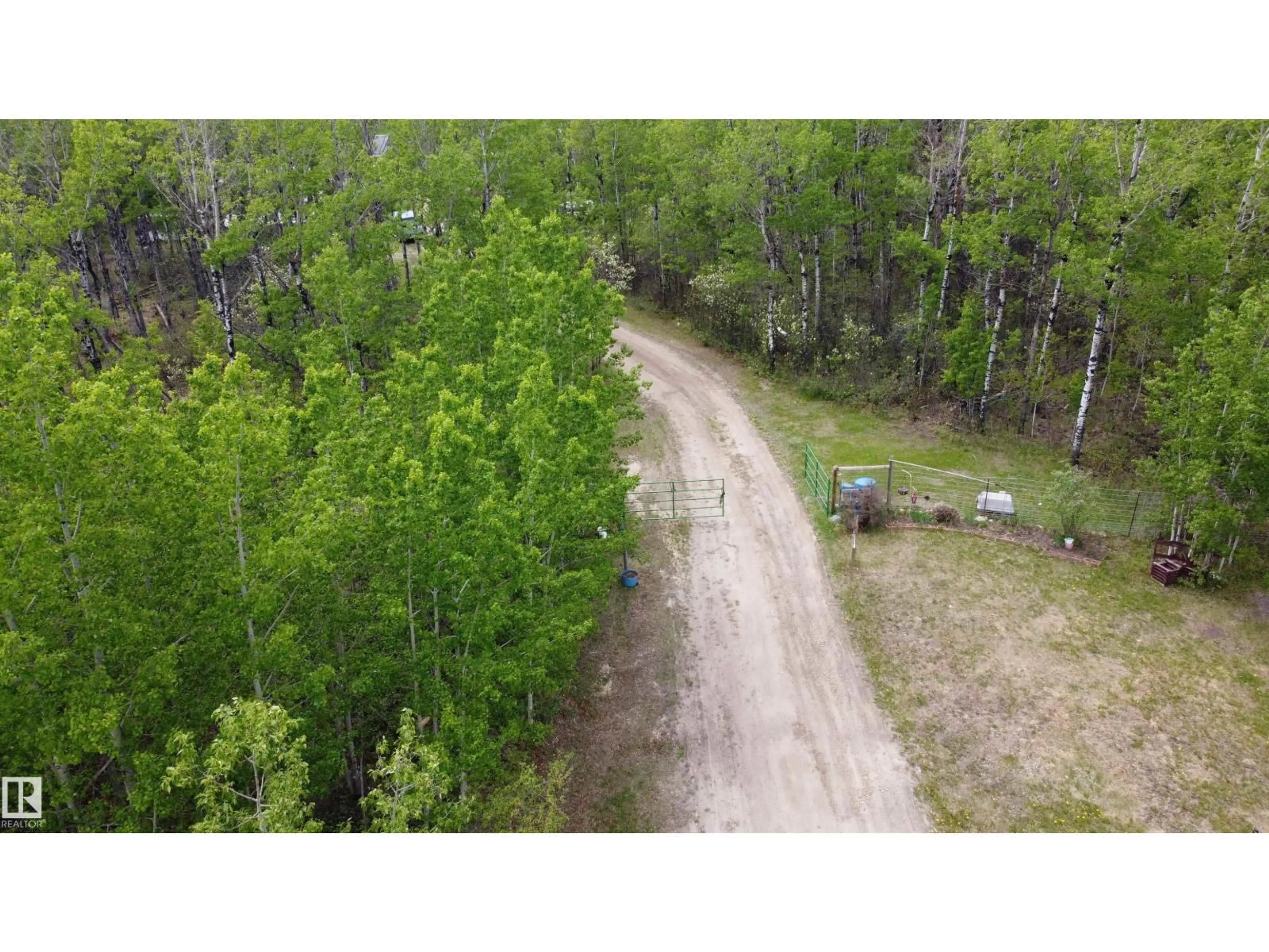 A pic from outside/outdoor area/front of a property/back of a property/a pic from drone, forest/trees view for 57318 RGE RD 25, Rural Barrhead County Alberta T0E1A0