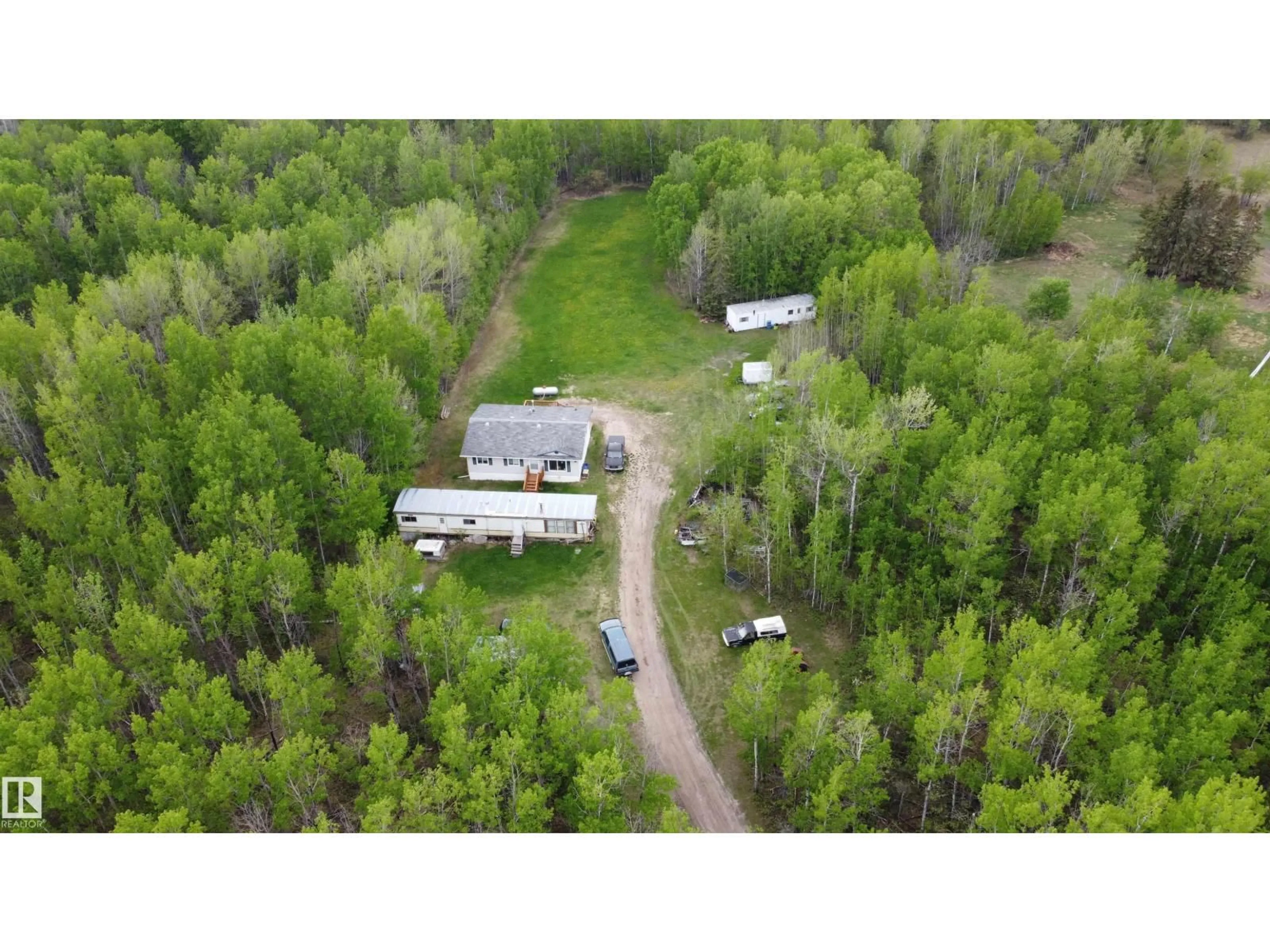 A pic from outside/outdoor area/front of a property/back of a property/a pic from drone, forest/trees view for 57318 RGE RD 25, Rural Barrhead County Alberta T0E1A0