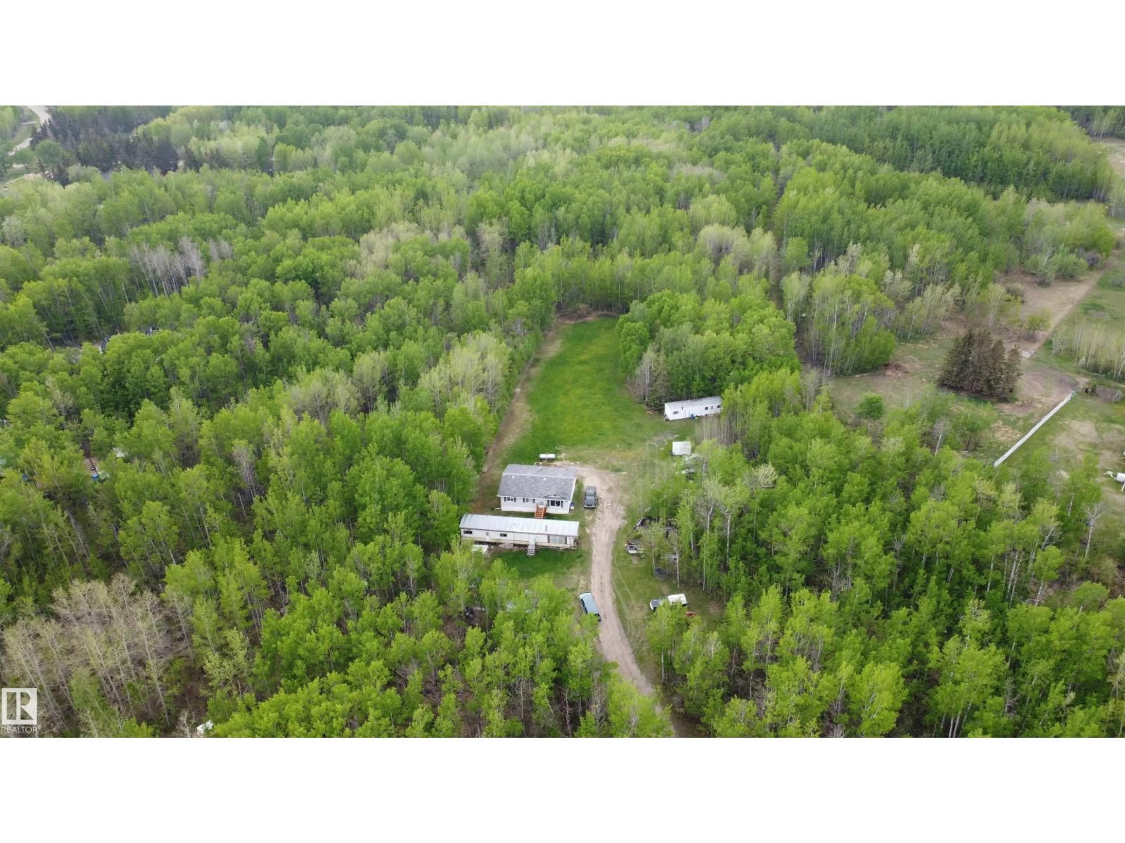 A pic from outside/outdoor area/front of a property/back of a property/a pic from drone, forest/trees view for 57318 RGE RD 25, Rural Barrhead County Alberta T0E1A0