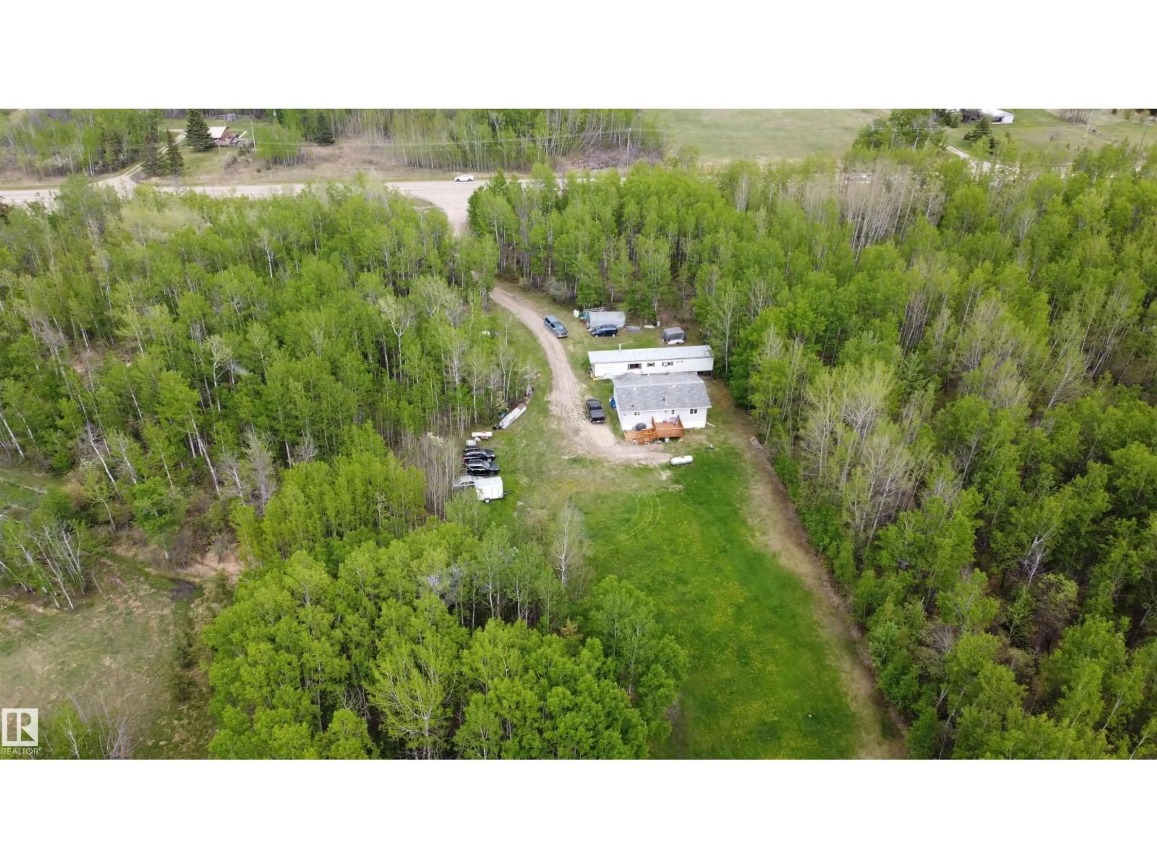 A pic from outside/outdoor area/front of a property/back of a property/a pic from drone, forest/trees view for 57318 RGE RD 25, Rural Barrhead County Alberta T0E1A0