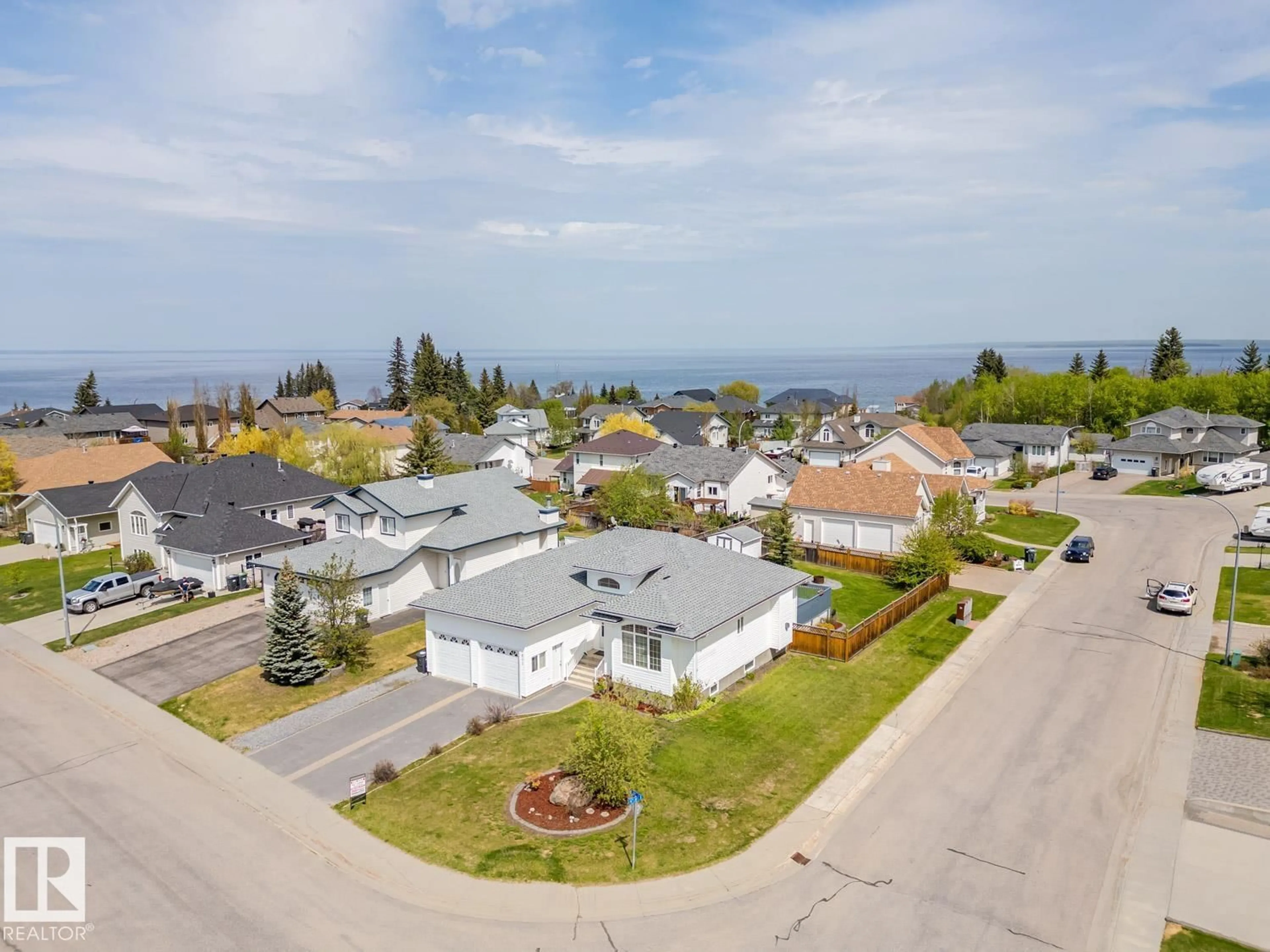 A pic from outside/outdoor area/front of a property/back of a property/a pic from drone, water/lake/river/ocean view for 601 26 ST, Cold Lake Alberta T9M1M6
