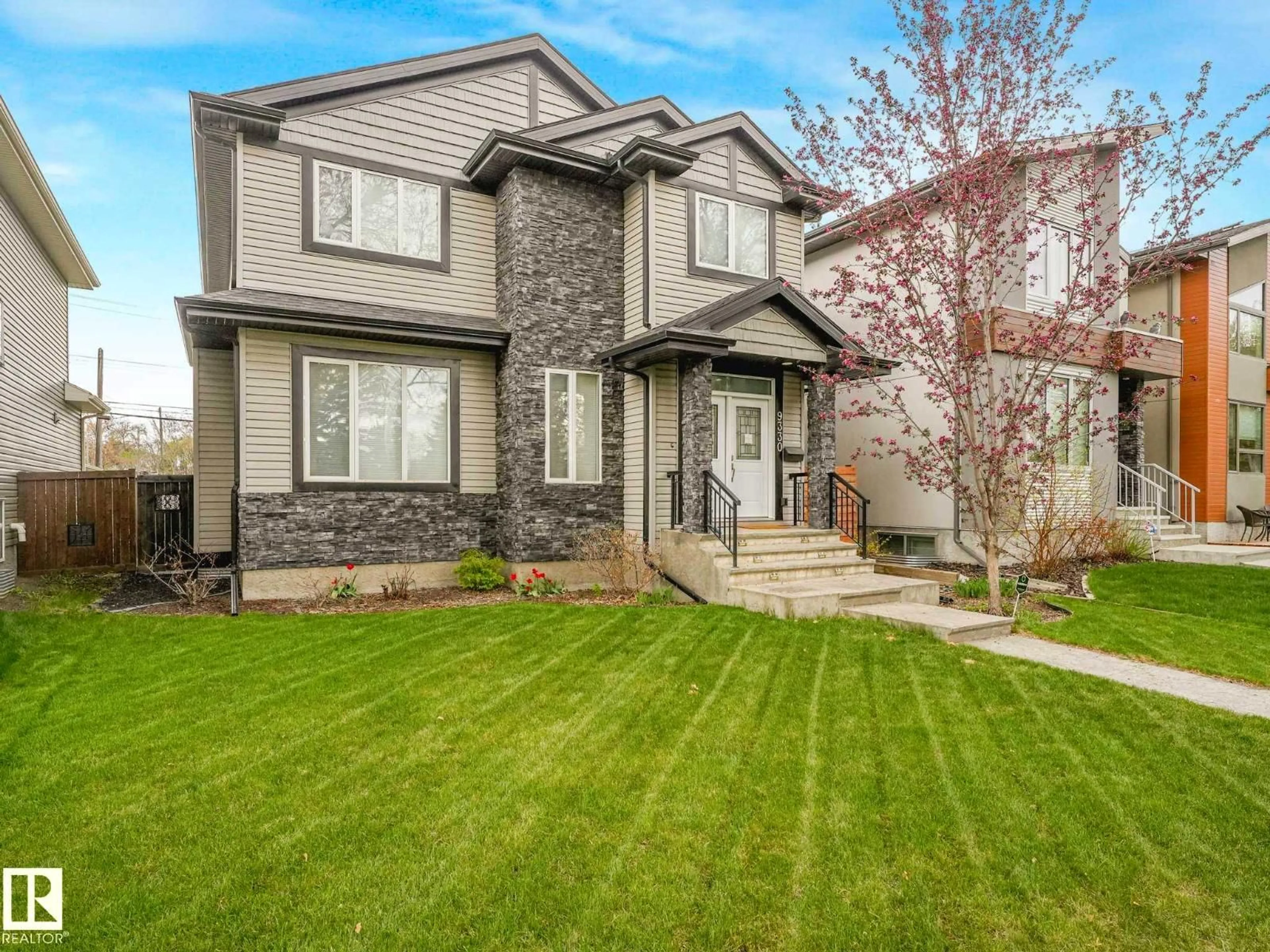 Home with vinyl exterior material, street for 9330 83 ST, Edmonton Alberta T6C2Z7