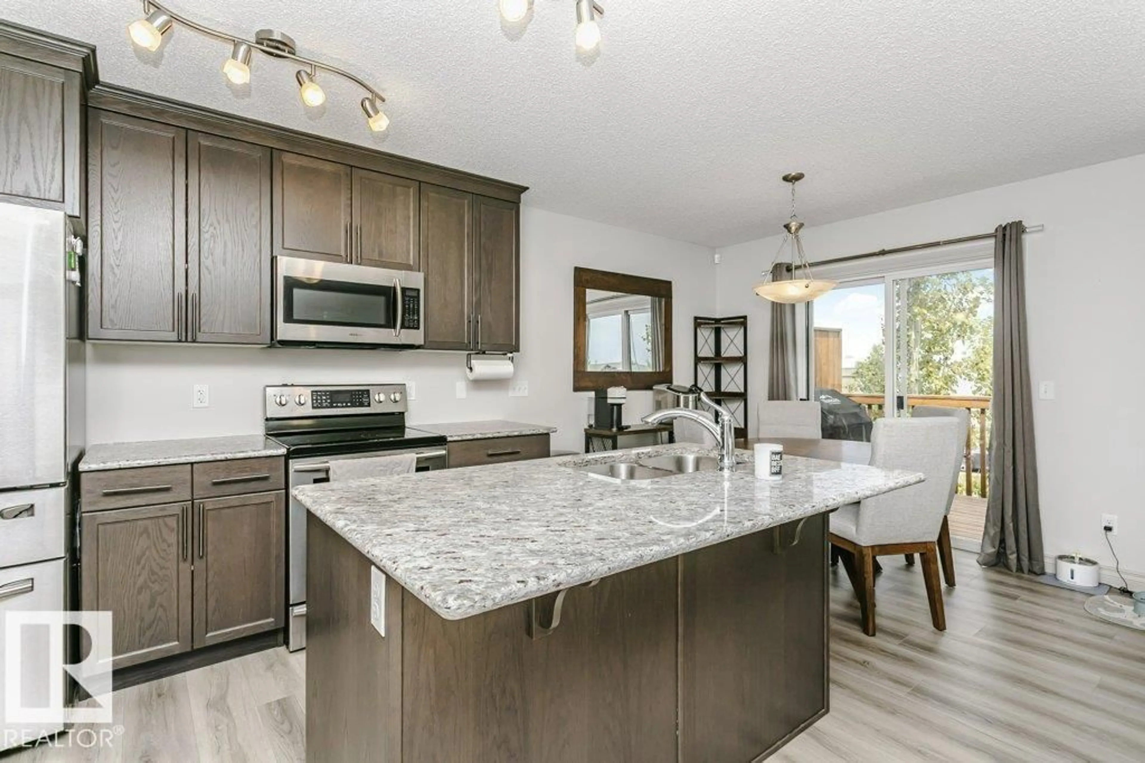 Open concept kitchen, ceramic/tile floor for 445 - 30 BRINTNELL BV, Edmonton Alberta T5Y0V5