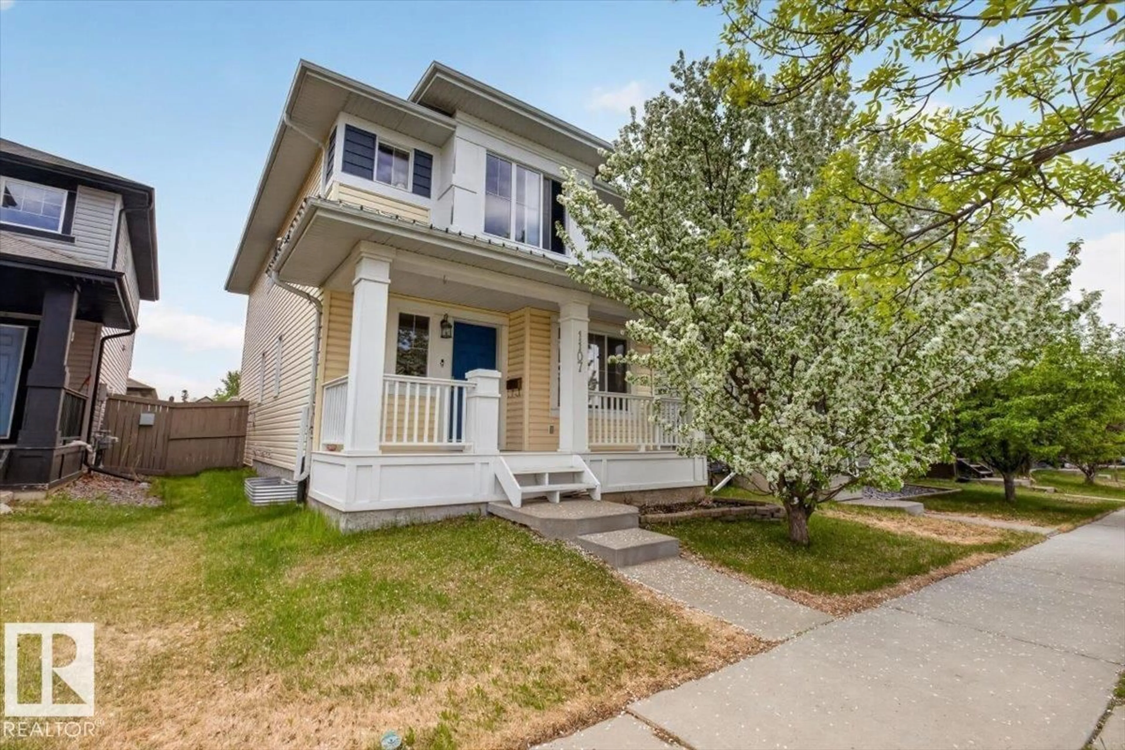 Home with vinyl exterior material, street for 1107 35 AV, Edmonton Alberta T6T0J8