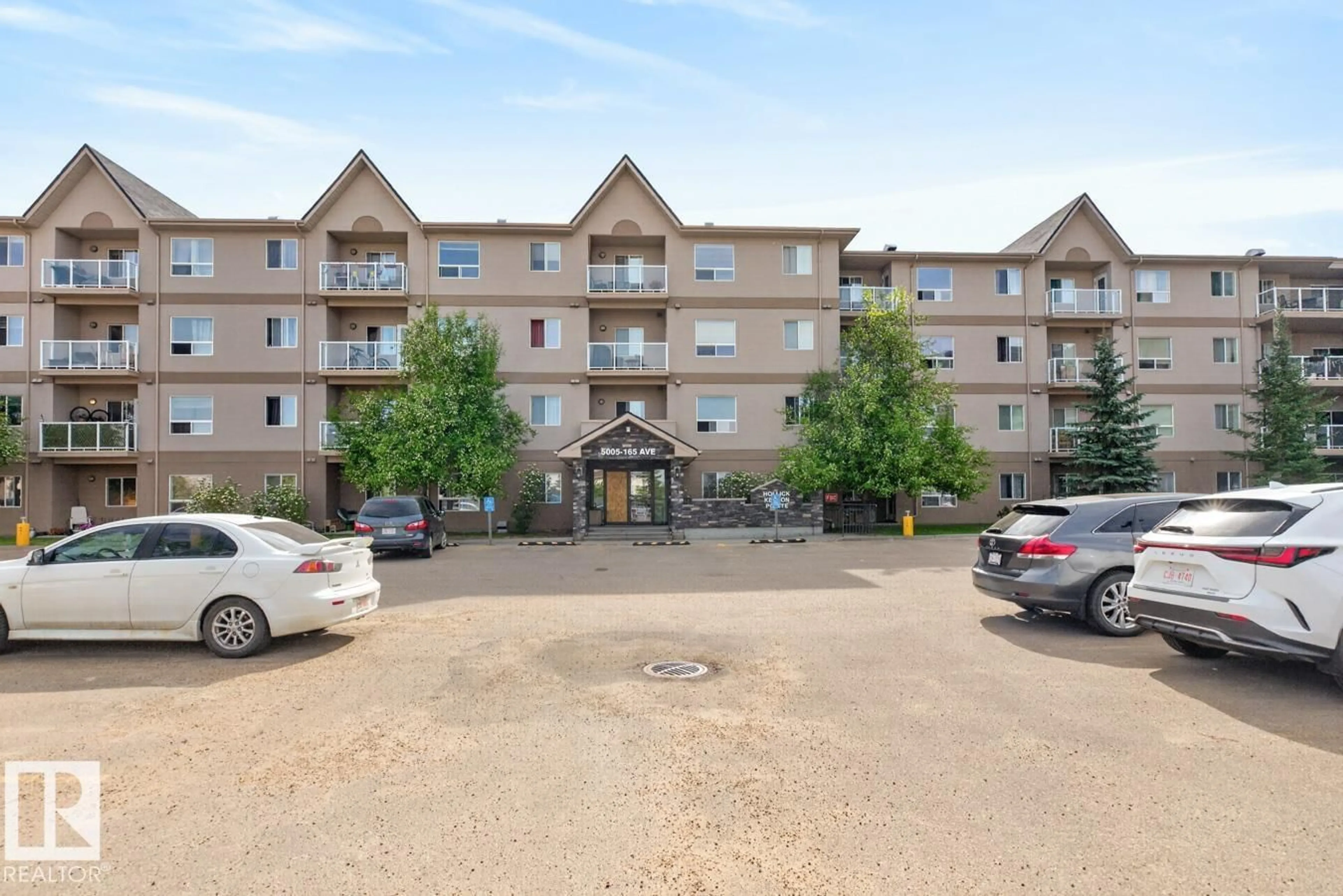 A pic from outside/outdoor area/front of a property/back of a property/a pic from drone, unknown for 320 - 5005 165 AV, Edmonton Alberta T5Y0L8