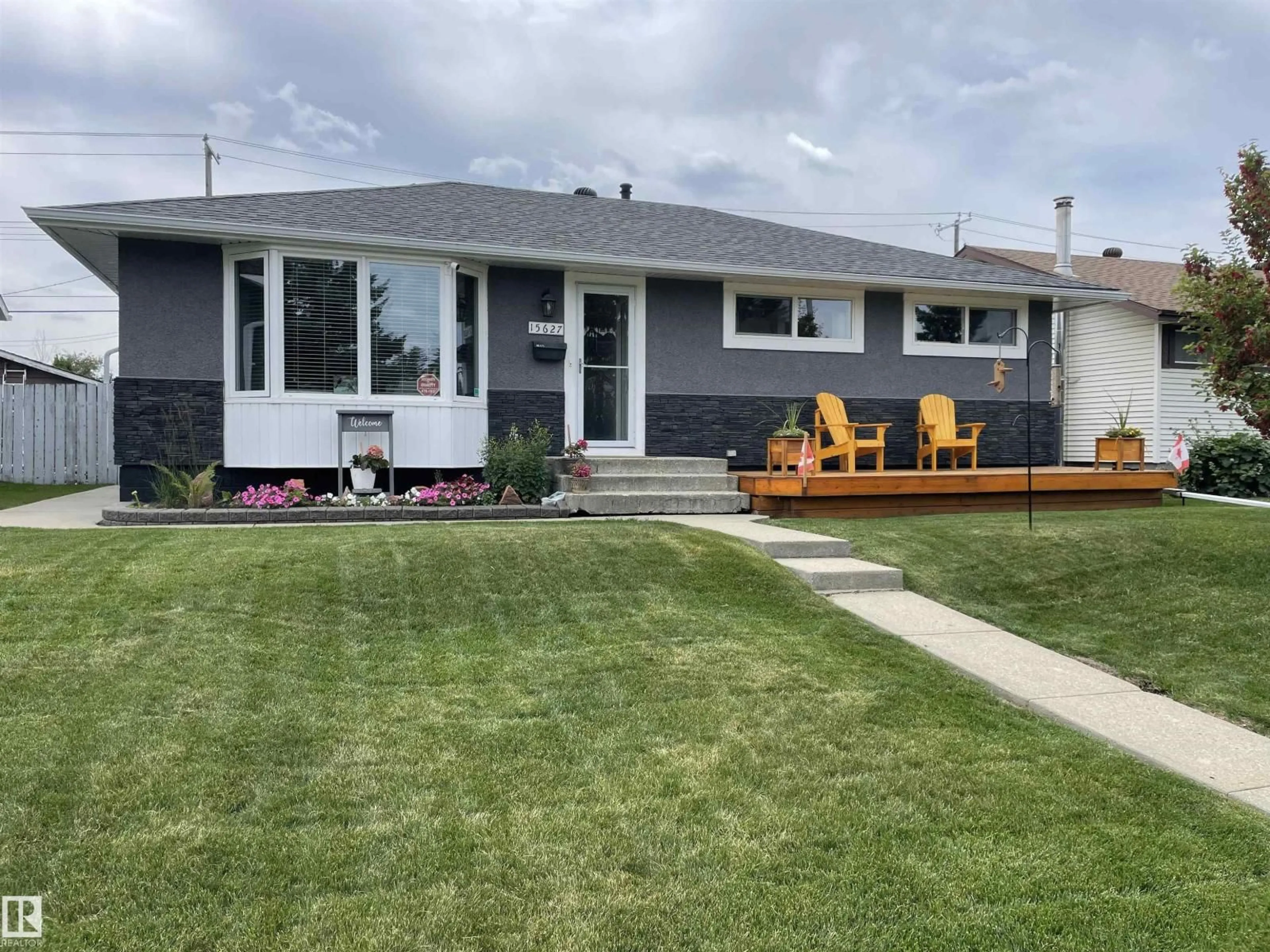 Home with vinyl exterior material, street for 15627 83 AV, Edmonton Alberta T5R3T6