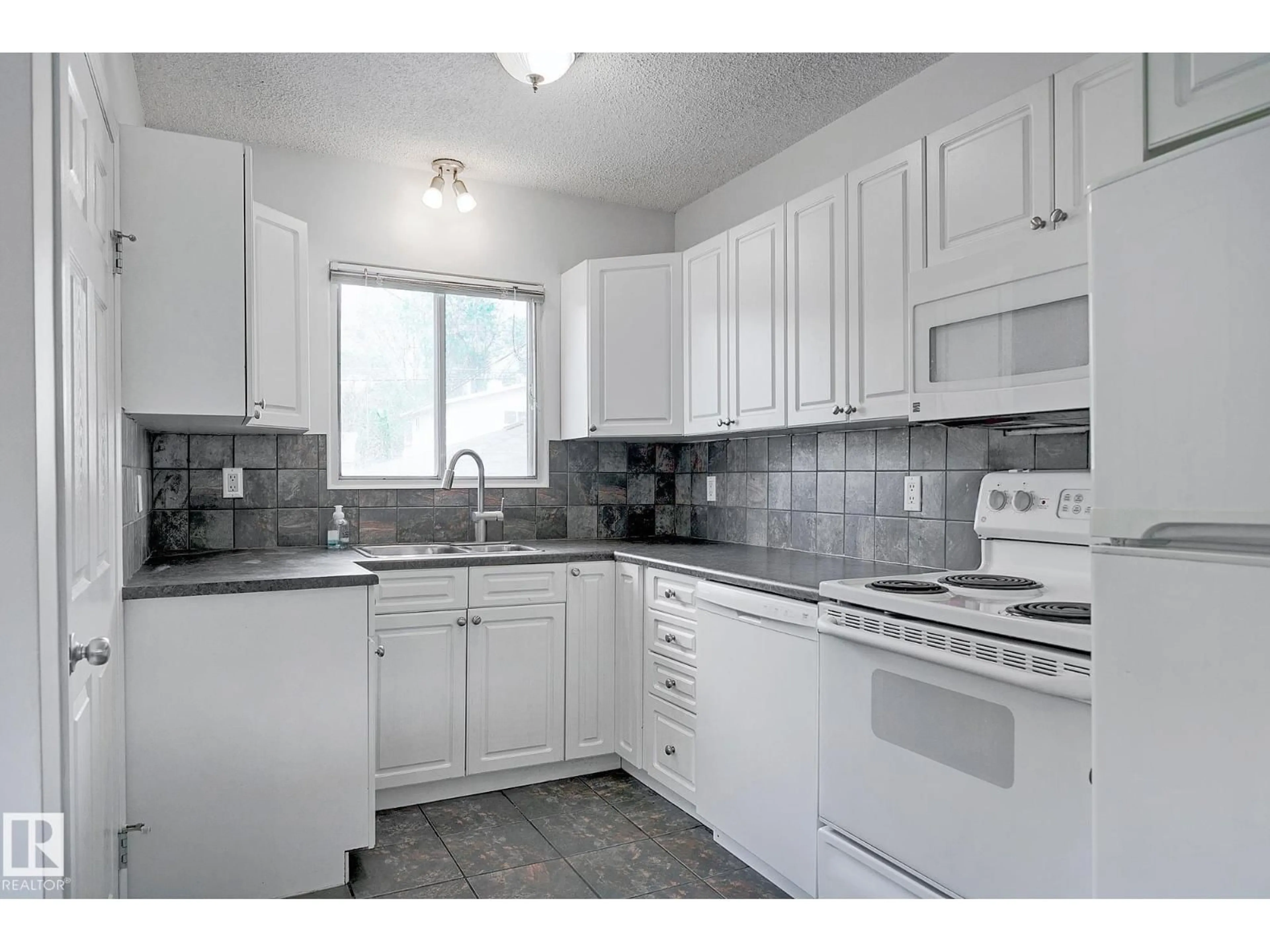 Standard kitchen, ceramic/tile floor for 11930 56 ST, Edmonton Alberta T5W3S9