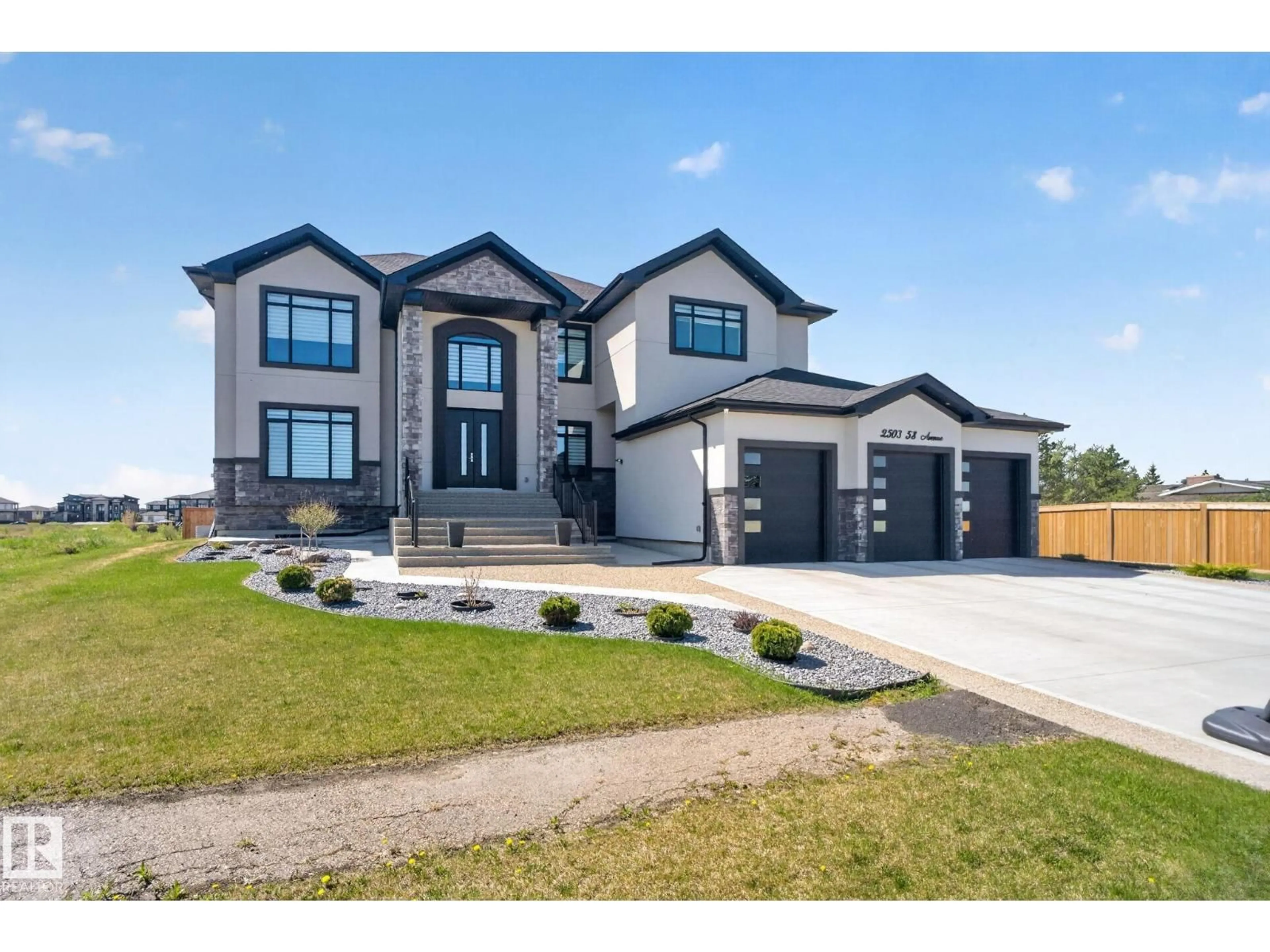 Home with brick exterior material, street for 2503 58 AV, Rural Leduc County Alberta T4X0X5