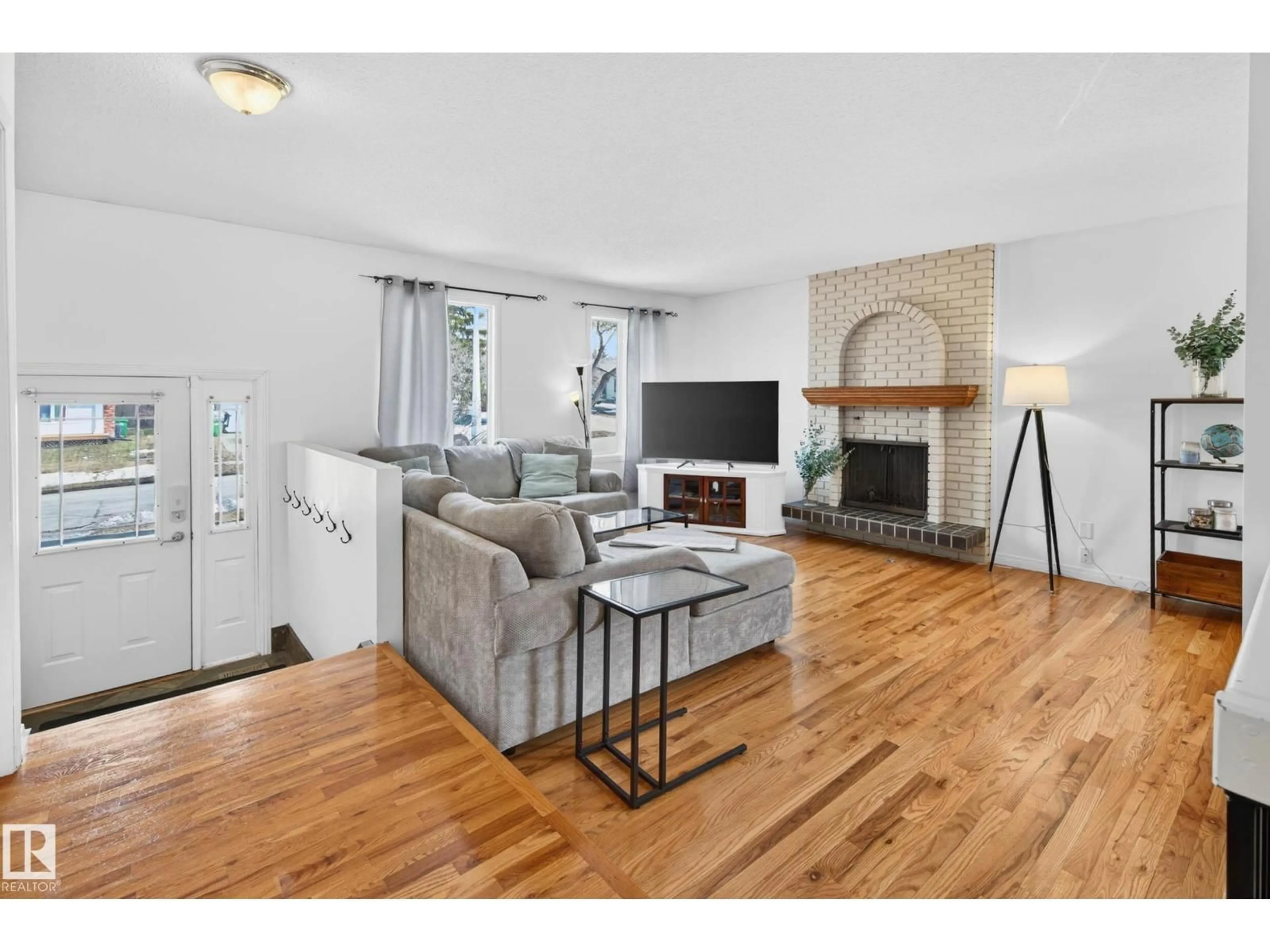 Living room with furniture, wood/laminate floor for 5 WILLOWBROOK CR, St. Albert Alberta T8N3H9