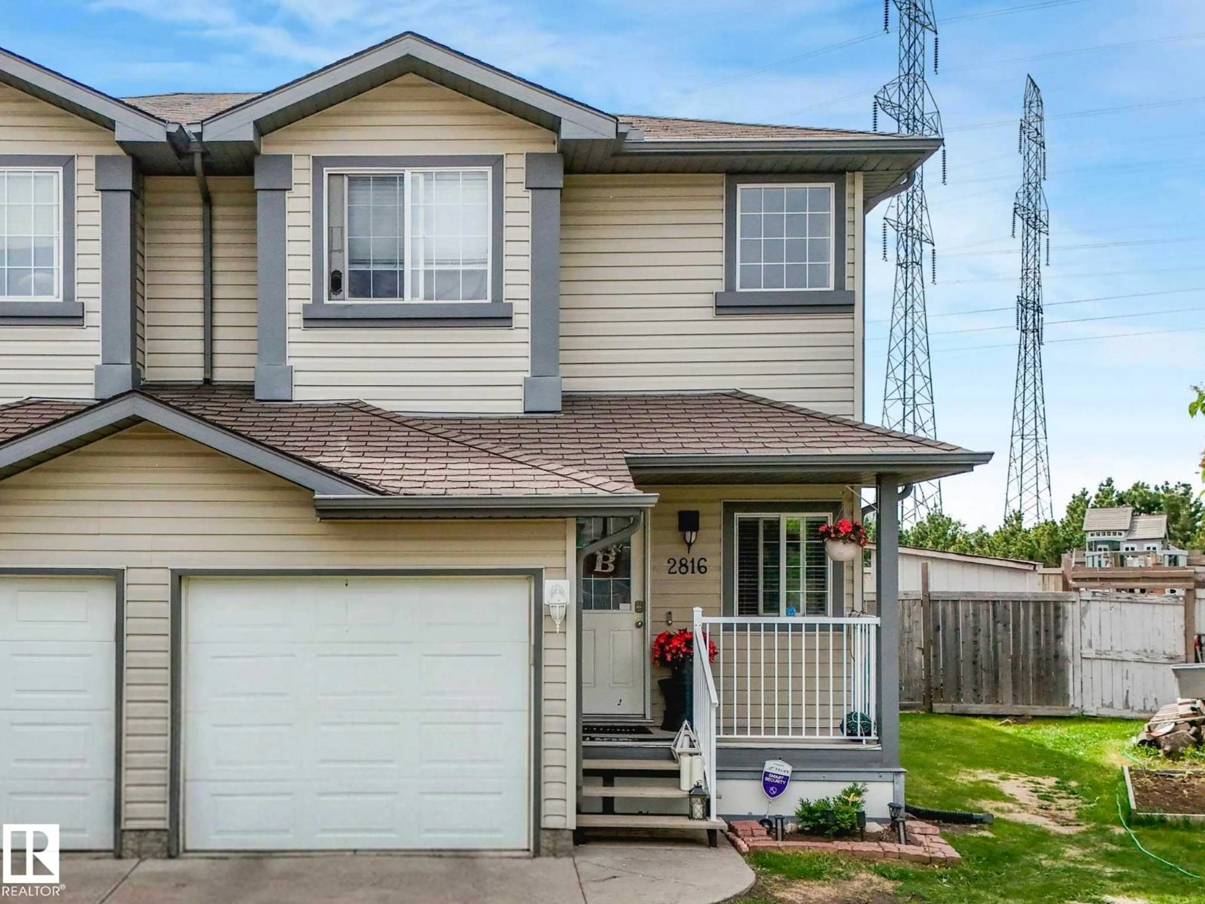 Home with vinyl exterior material, street for 2816 26 ST, Edmonton Alberta T6T2A2