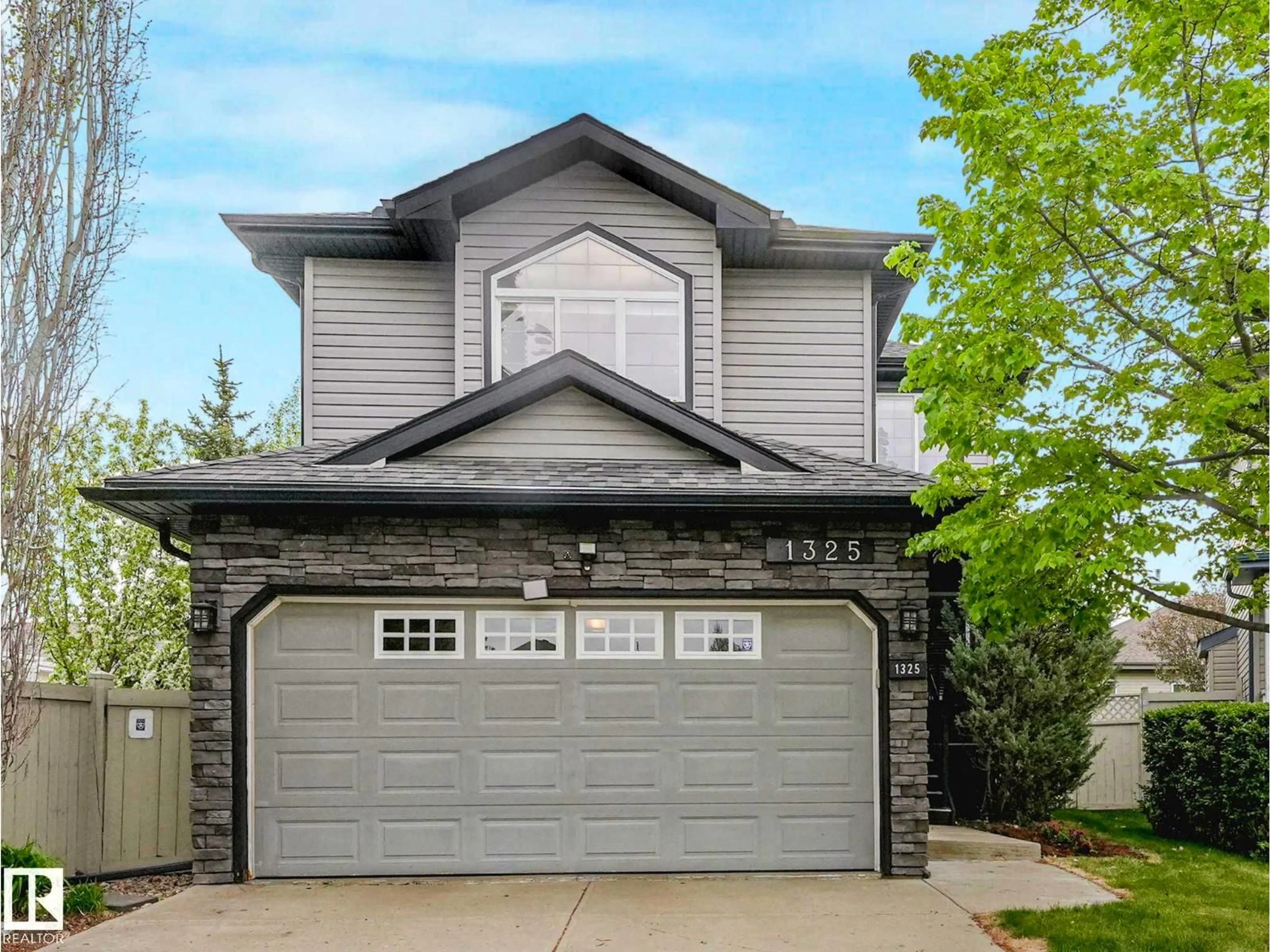 Home with vinyl exterior material, street for 1325 LATTA CR, Edmonton Alberta T6R3T3