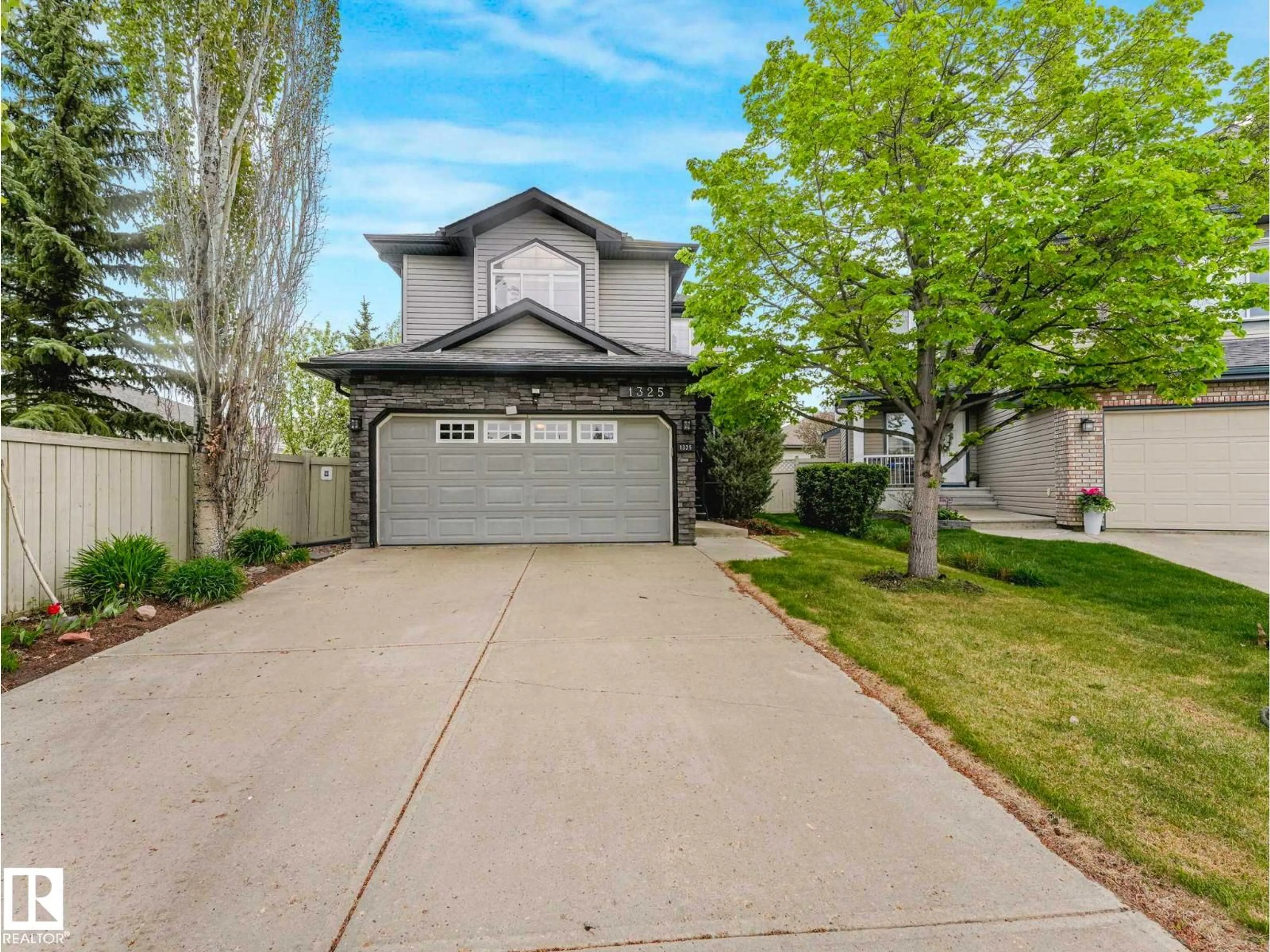 Home with vinyl exterior material, street for 1325 LATTA CR, Edmonton Alberta T6R3T3