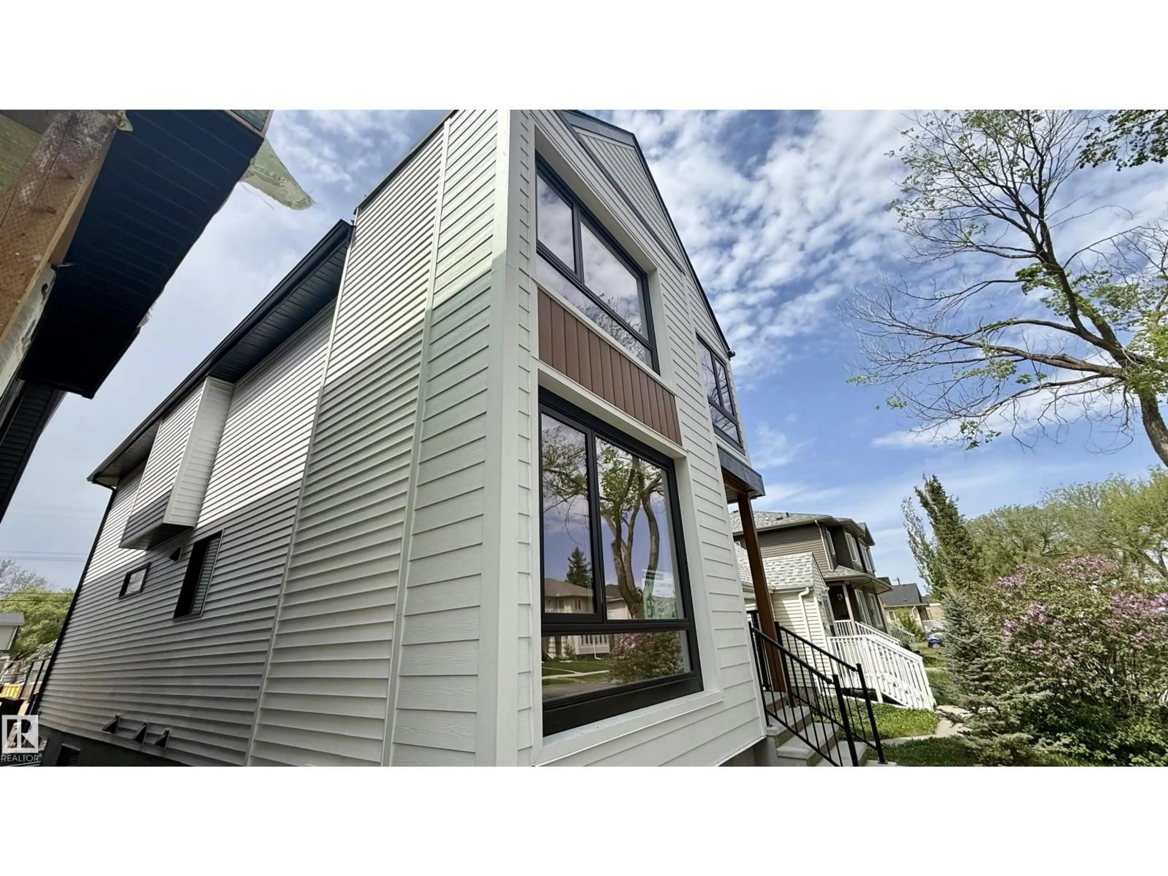 Home with vinyl exterior material, street for NW - 11712 122 ST, Edmonton Alberta T5M0C3
