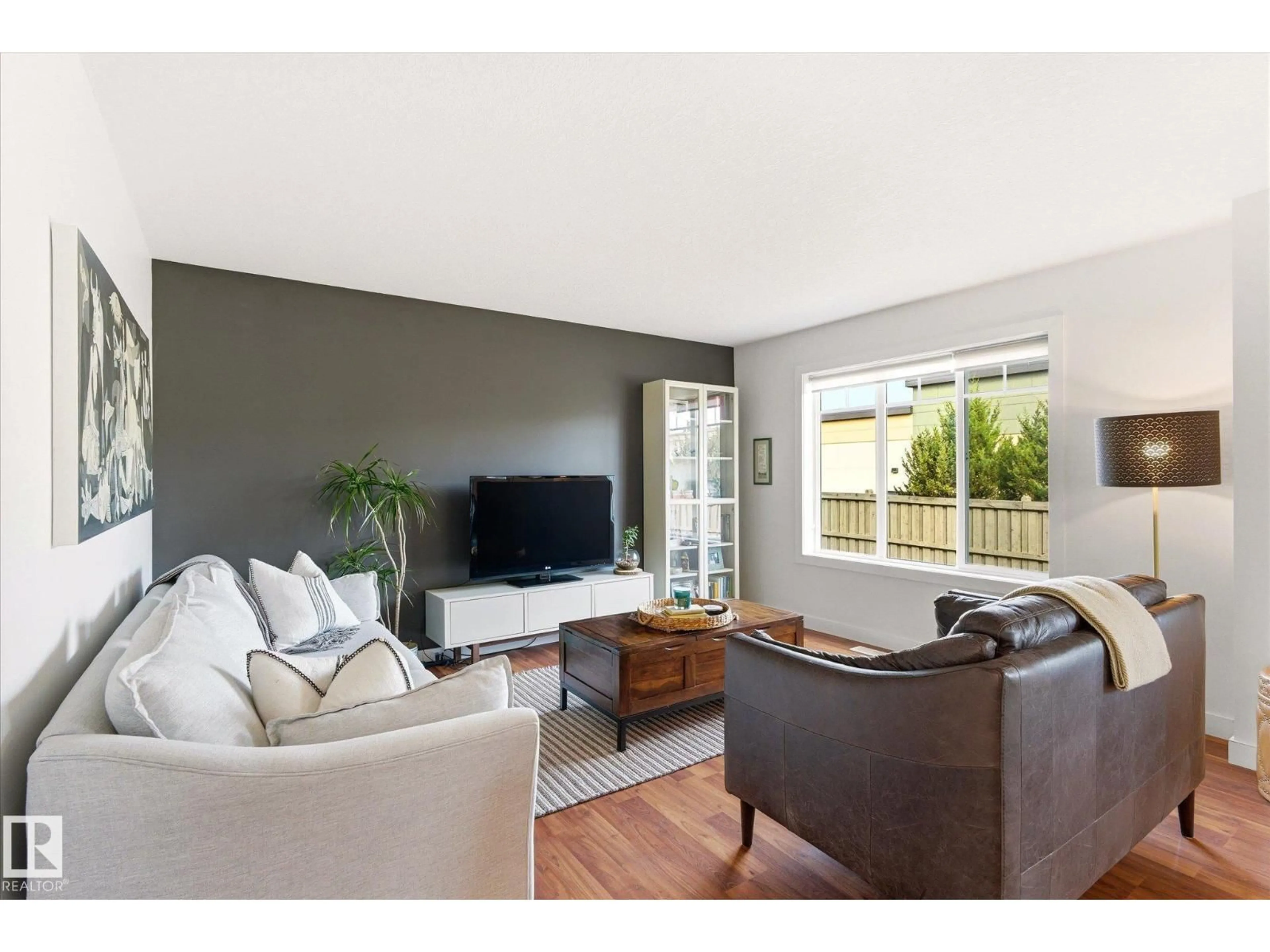 Living room with furniture, wood/laminate floor for #3 - 5134 MULLEN RD, Edmonton Alberta T6R0S7