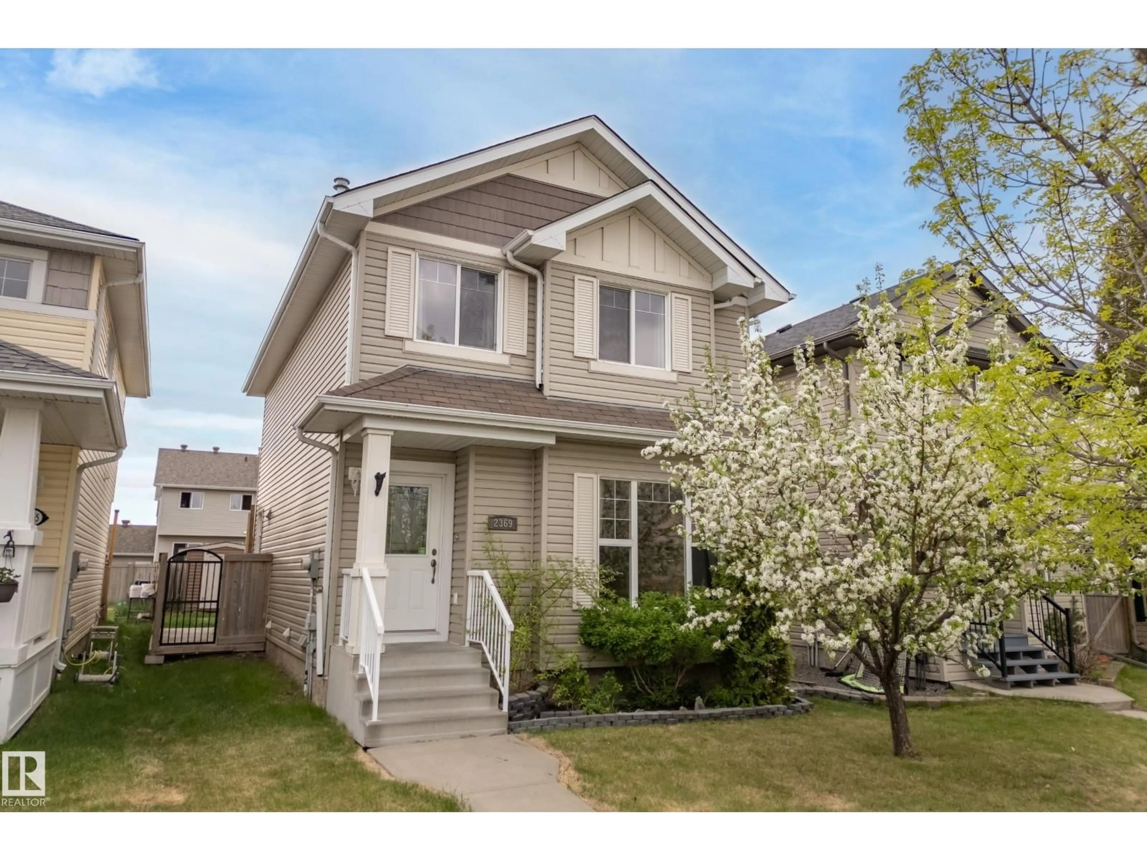 Home with vinyl exterior material, street for 2369 27 AV, Edmonton Alberta T6T0A6