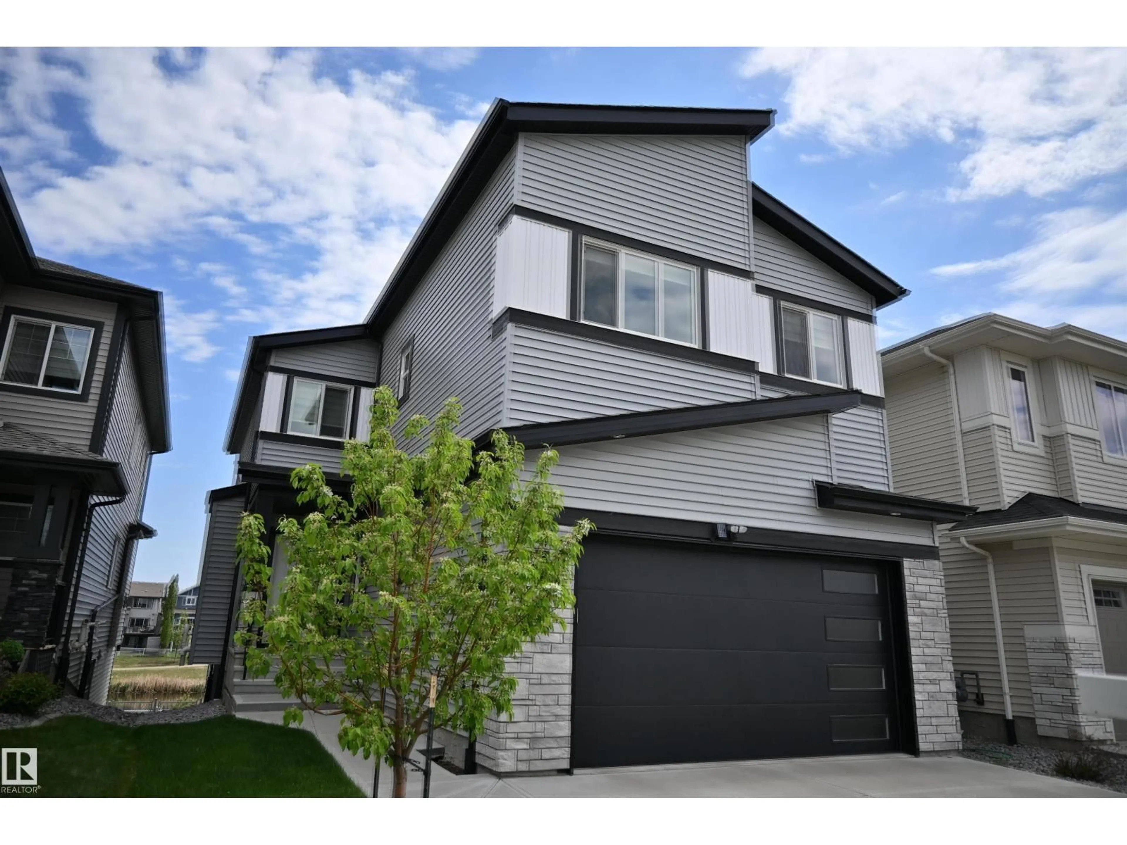 Home with vinyl exterior material, street for NW - 9831 223 ST, Edmonton Alberta T5T7B6