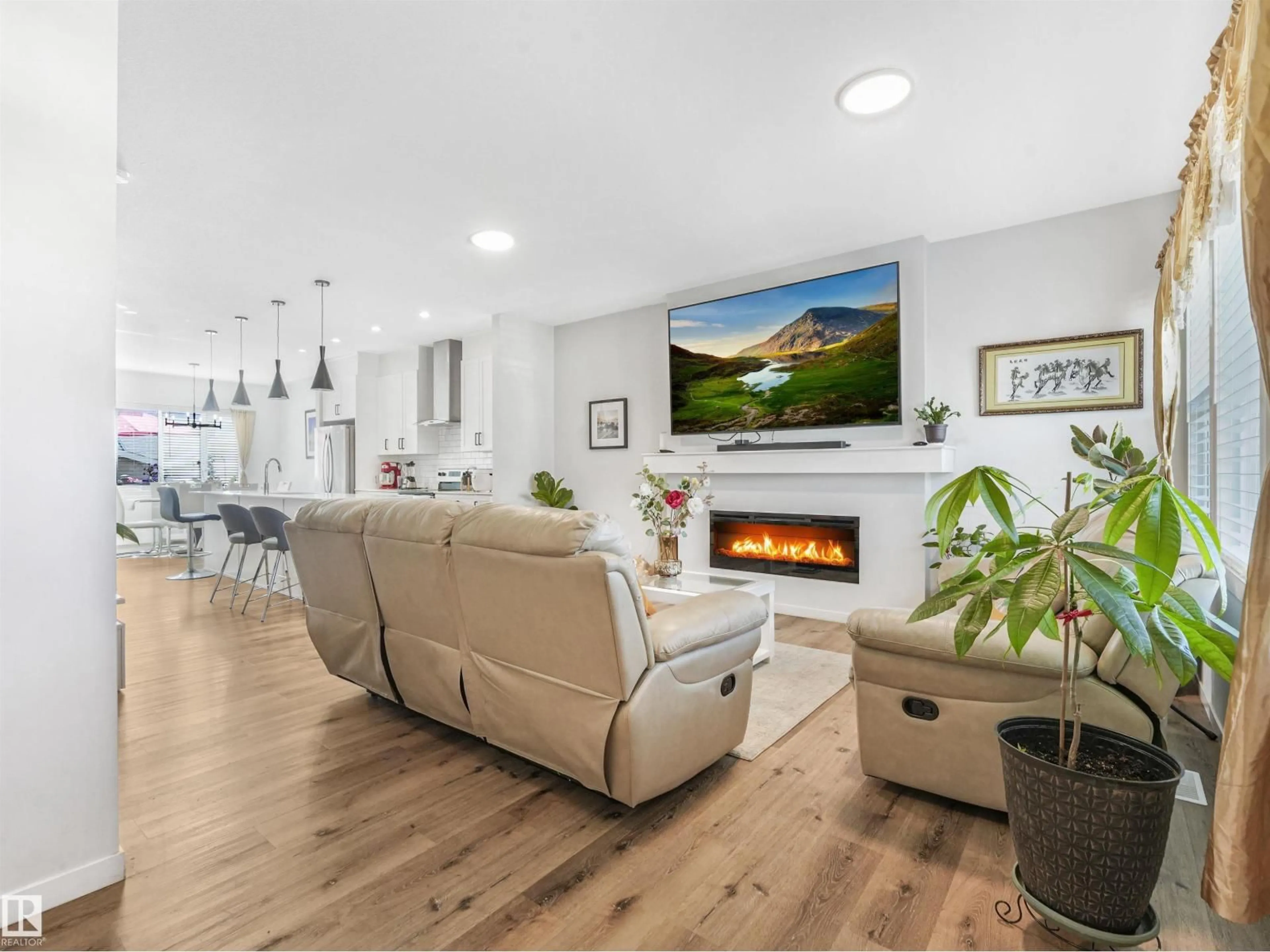 Living room with furniture, wood/laminate floor for 9311 226 ST, Edmonton Alberta T5T7R5