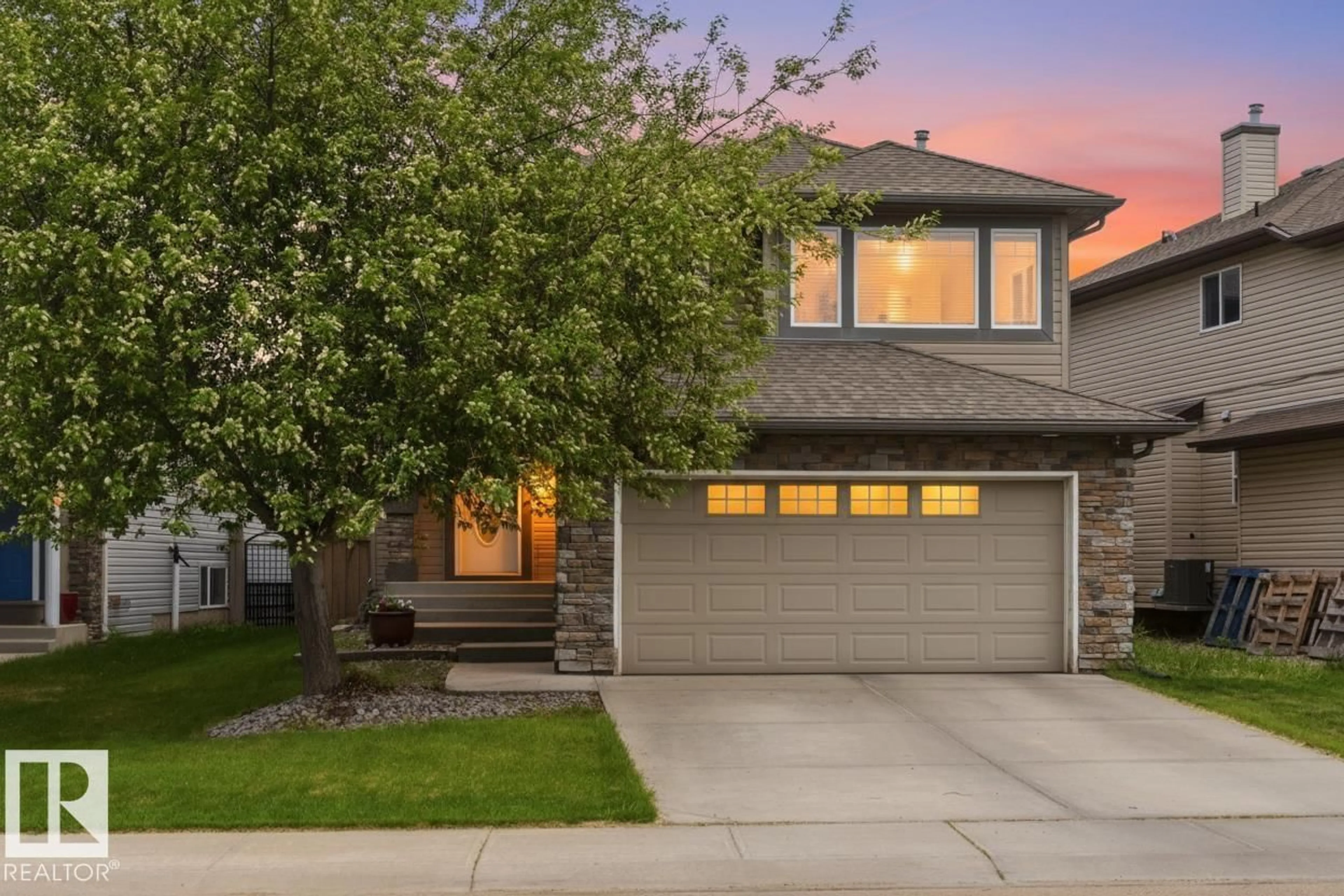 Home with vinyl exterior material, street for 7307 SINGER WY, Edmonton Alberta T6R3S1