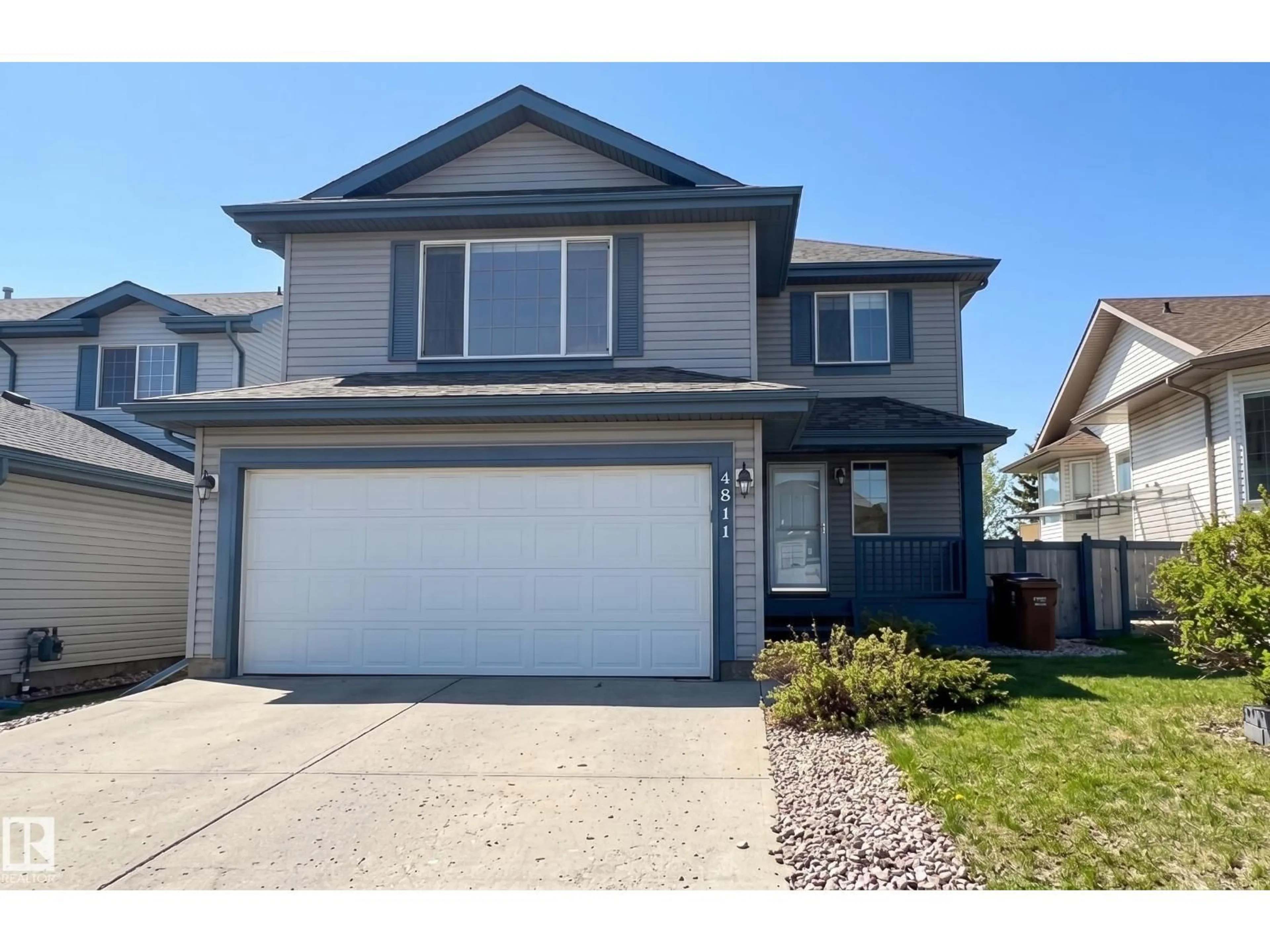 Home with vinyl exterior material, street for 4811 152 AV, Edmonton Alberta T5Y3B8