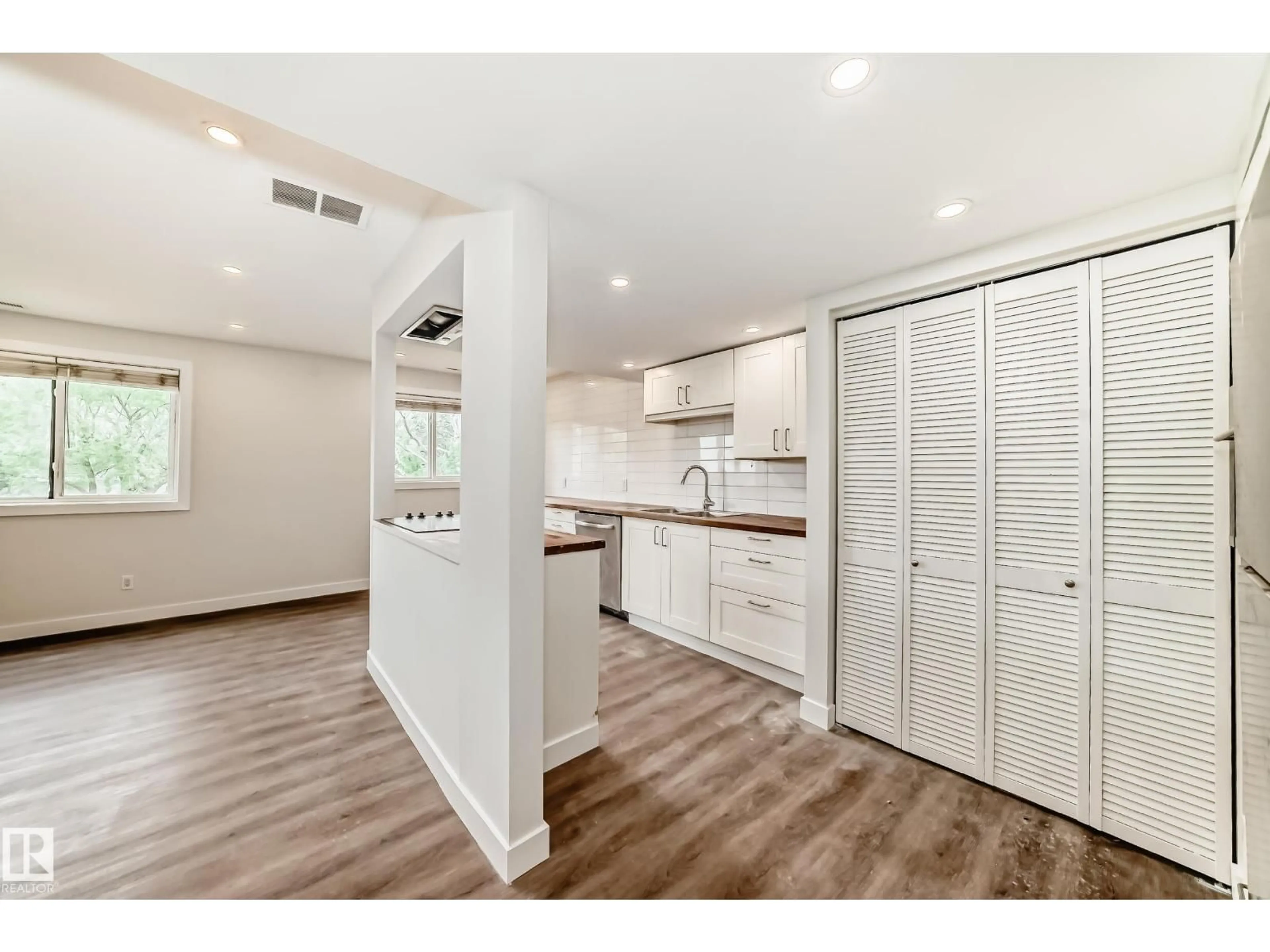Open concept kitchen, wood/laminate floor for 1488 LAKEWOOD RD, Edmonton Alberta T6K3M2