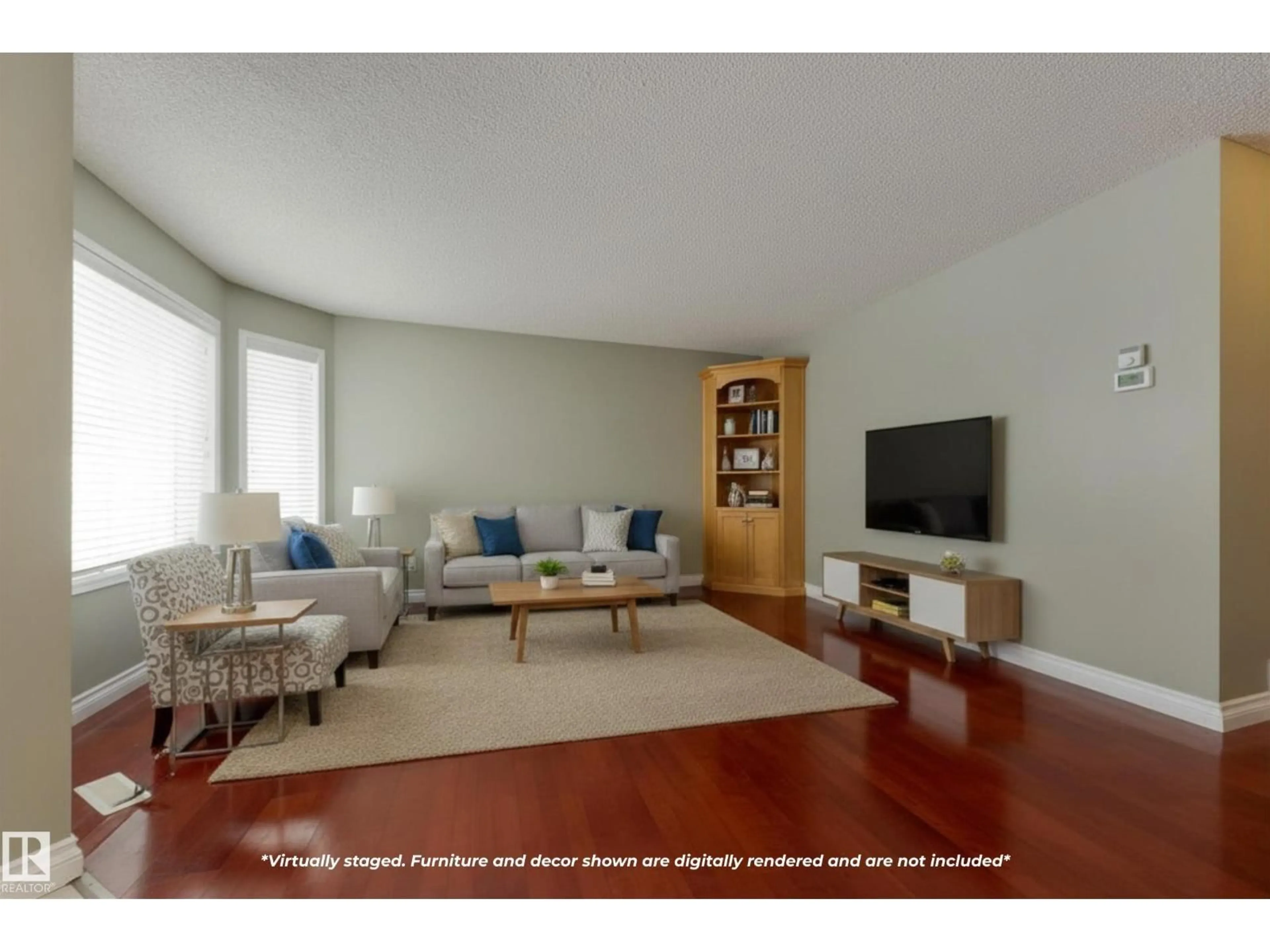 Living room with furniture, wood/laminate floor for 9916 178 AV, Edmonton Alberta T5X5X2