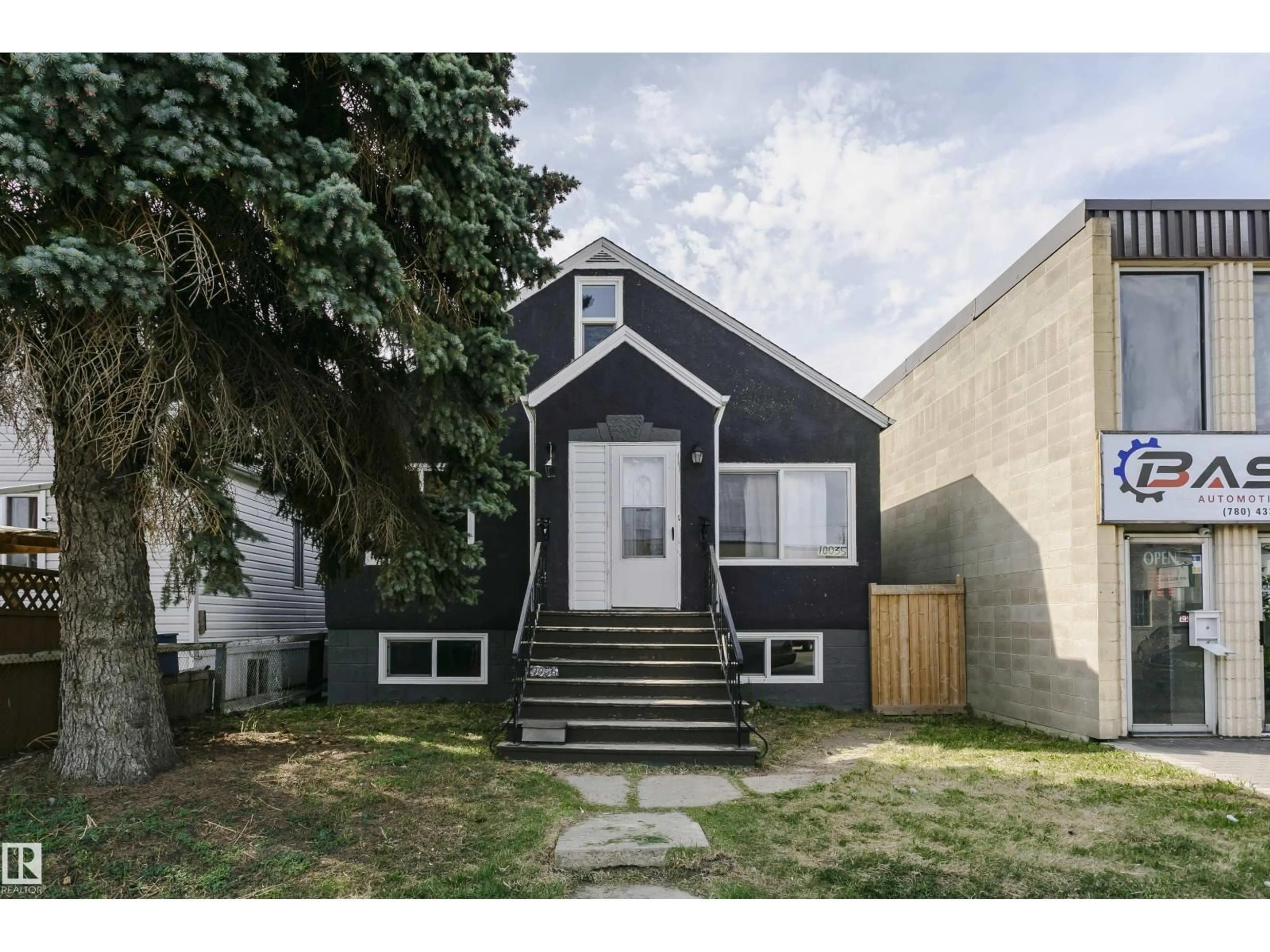 Home with vinyl exterior material, street for 10035 81 AV, Edmonton Alberta T6E1W7