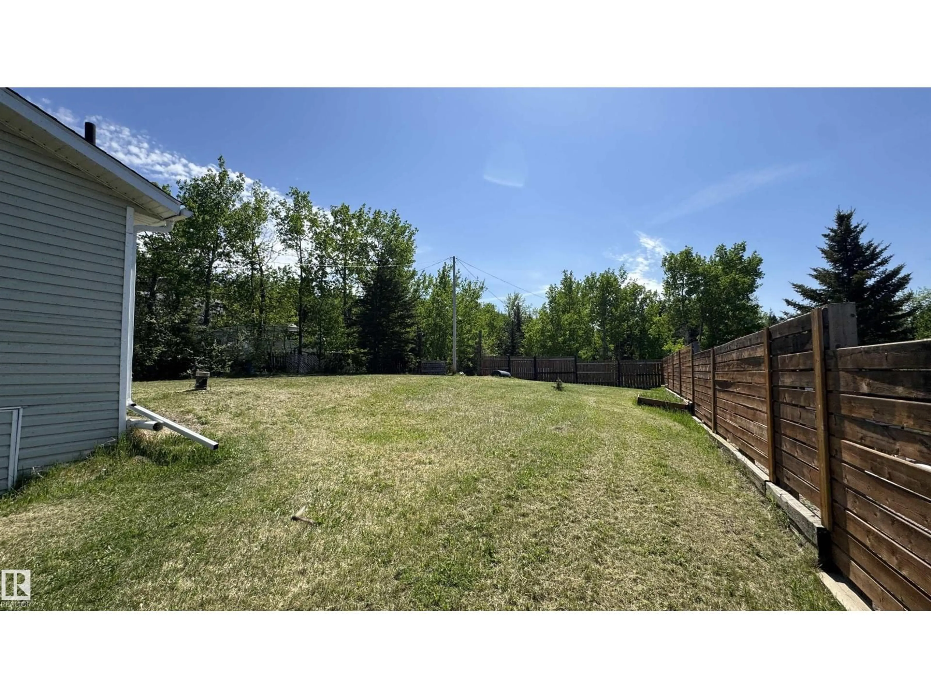 A pic from outside/outdoor area/front of a property/back of a property/a pic from drone, forest/trees view for 322 - 11121 TWP ROAD 595, Rural St. Paul County Alberta T0A0C0