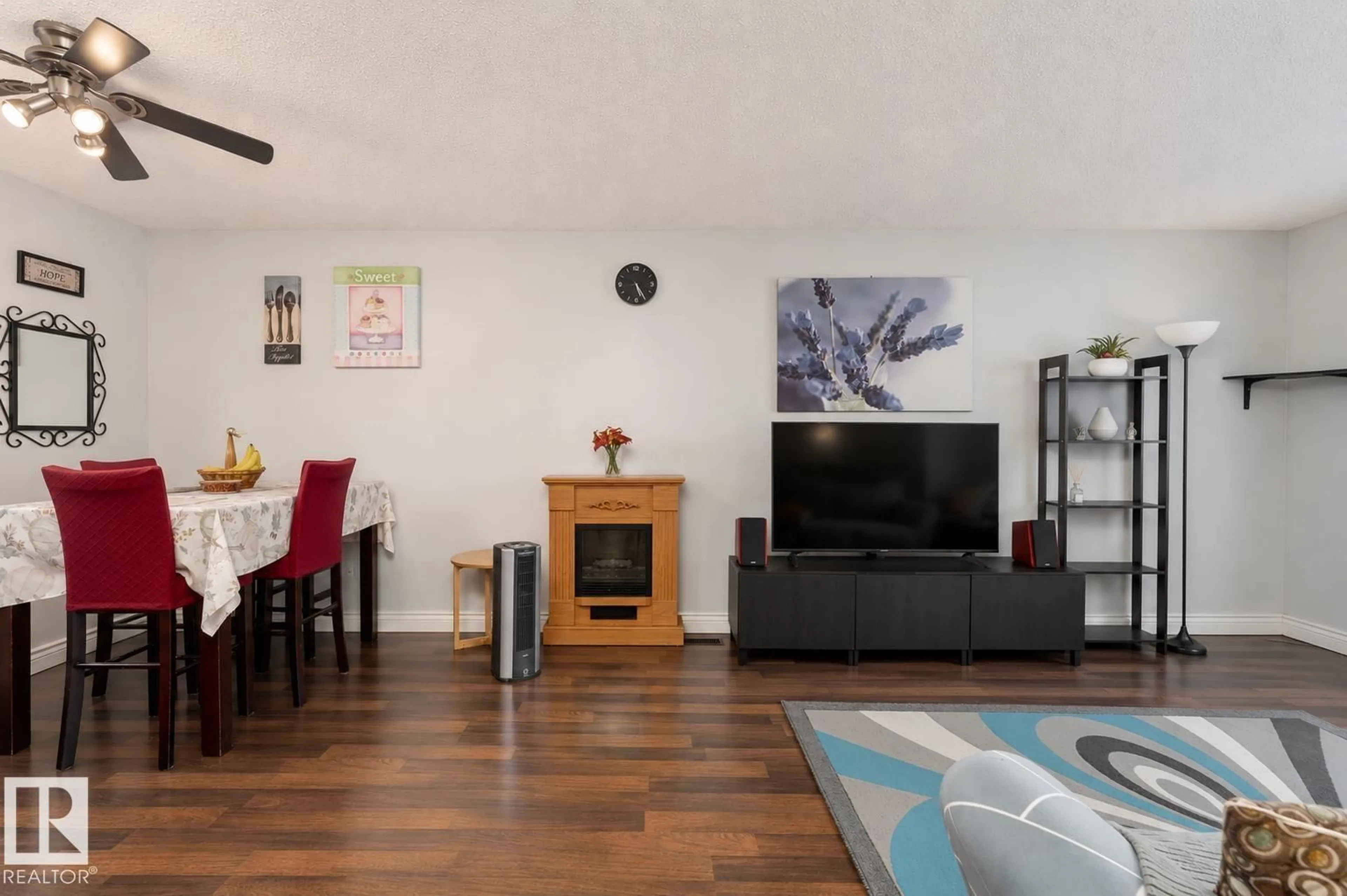 Living room with furniture, wood/laminate floor for NW - 4620 37A AV, Edmonton Alberta T6L3A6