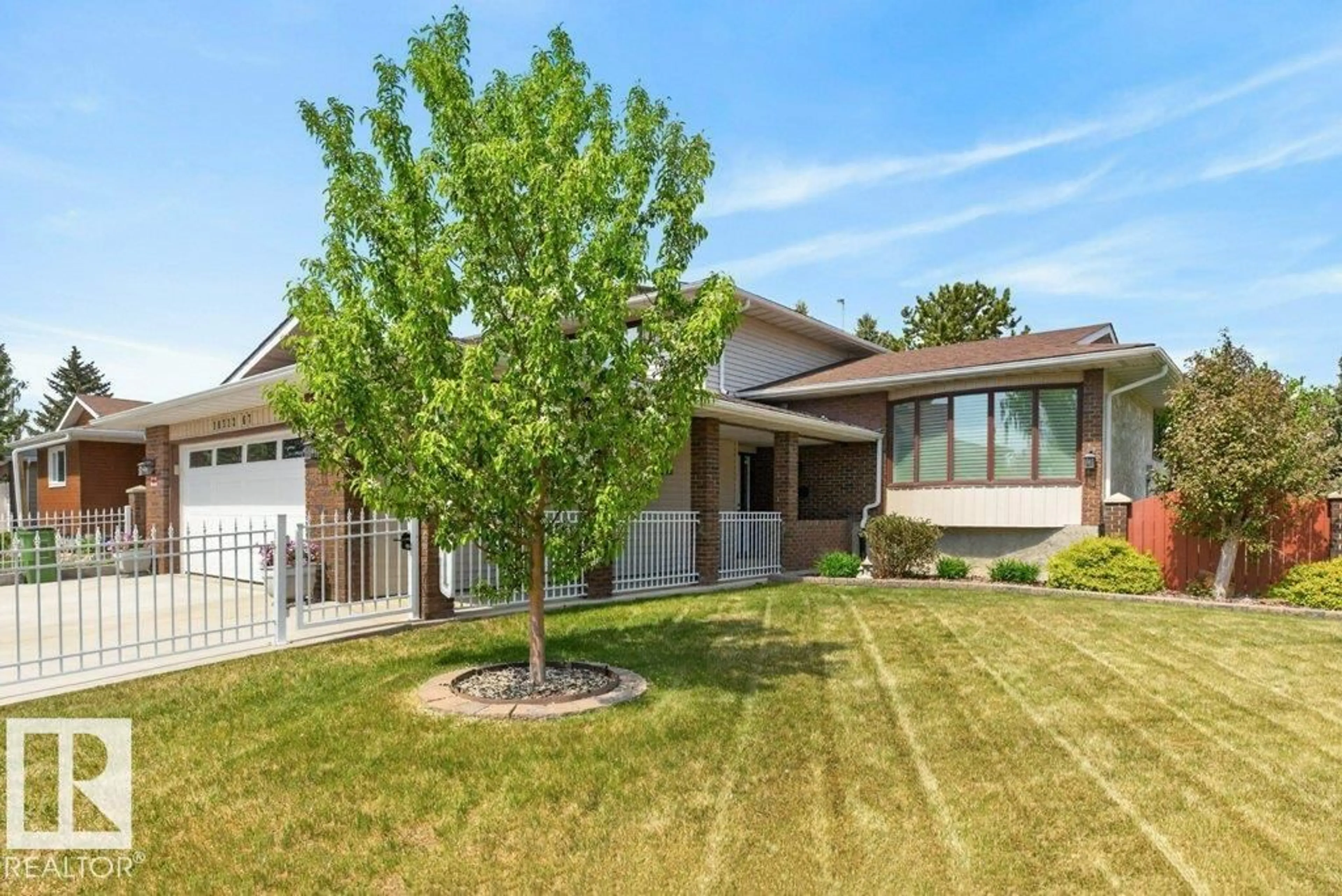 Home with brick exterior material, street for 18312 67 AV, Edmonton Alberta T5T2H8