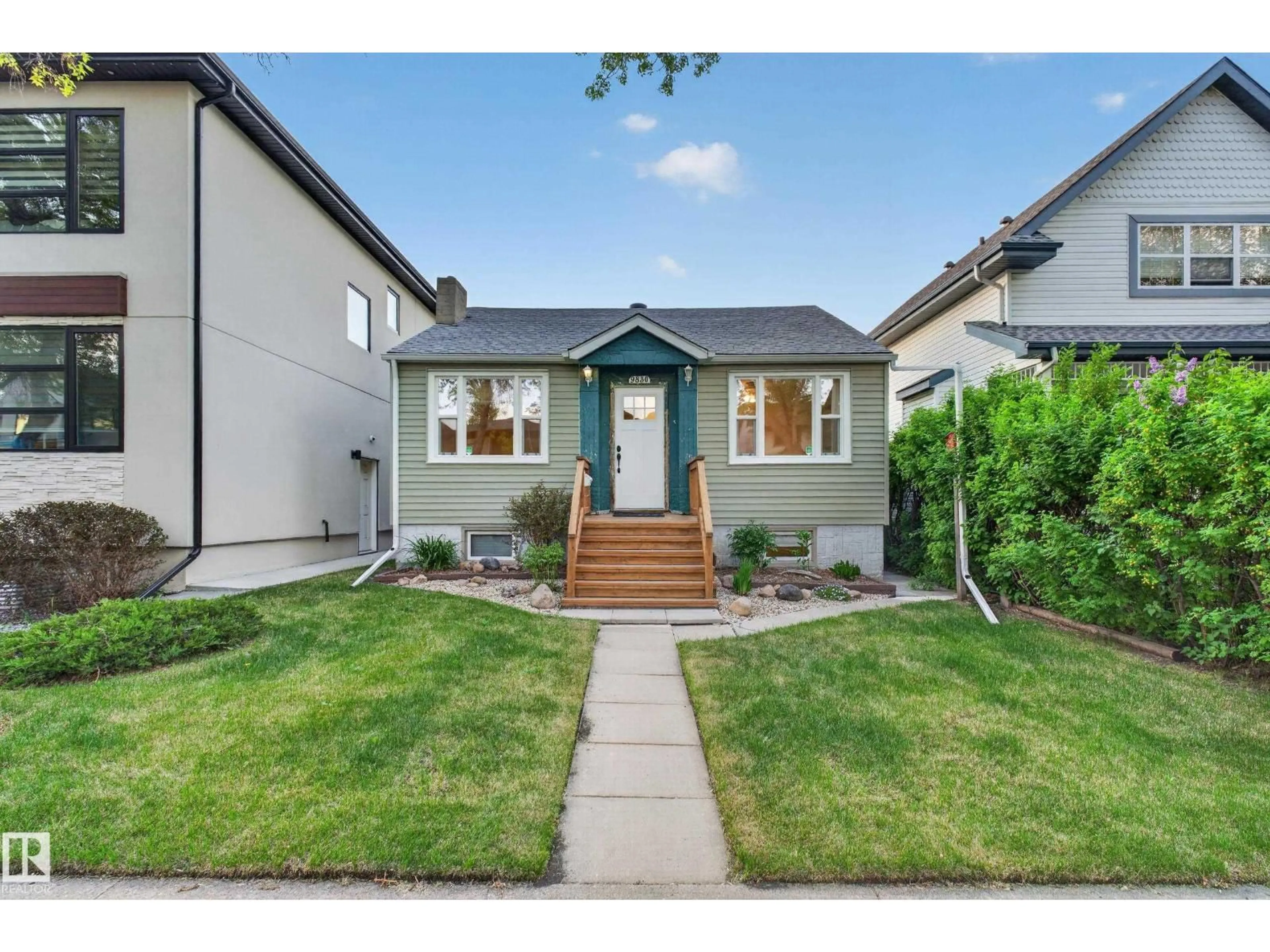 Home with vinyl exterior material, street for 9830 77 AV, Edmonton Alberta T6E1M4