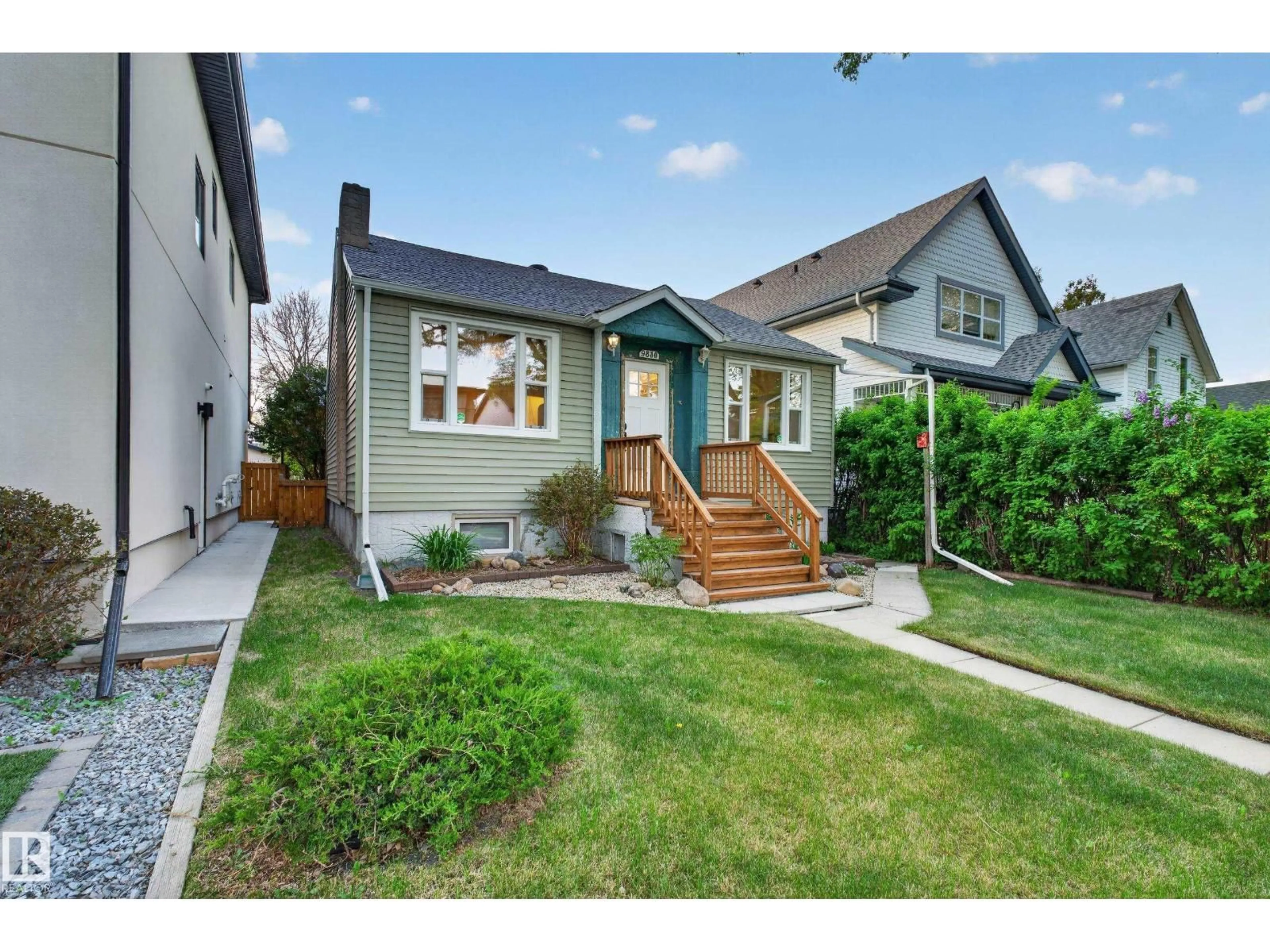 Home with vinyl exterior material, street for 9830 77 AV, Edmonton Alberta T6E1M4
