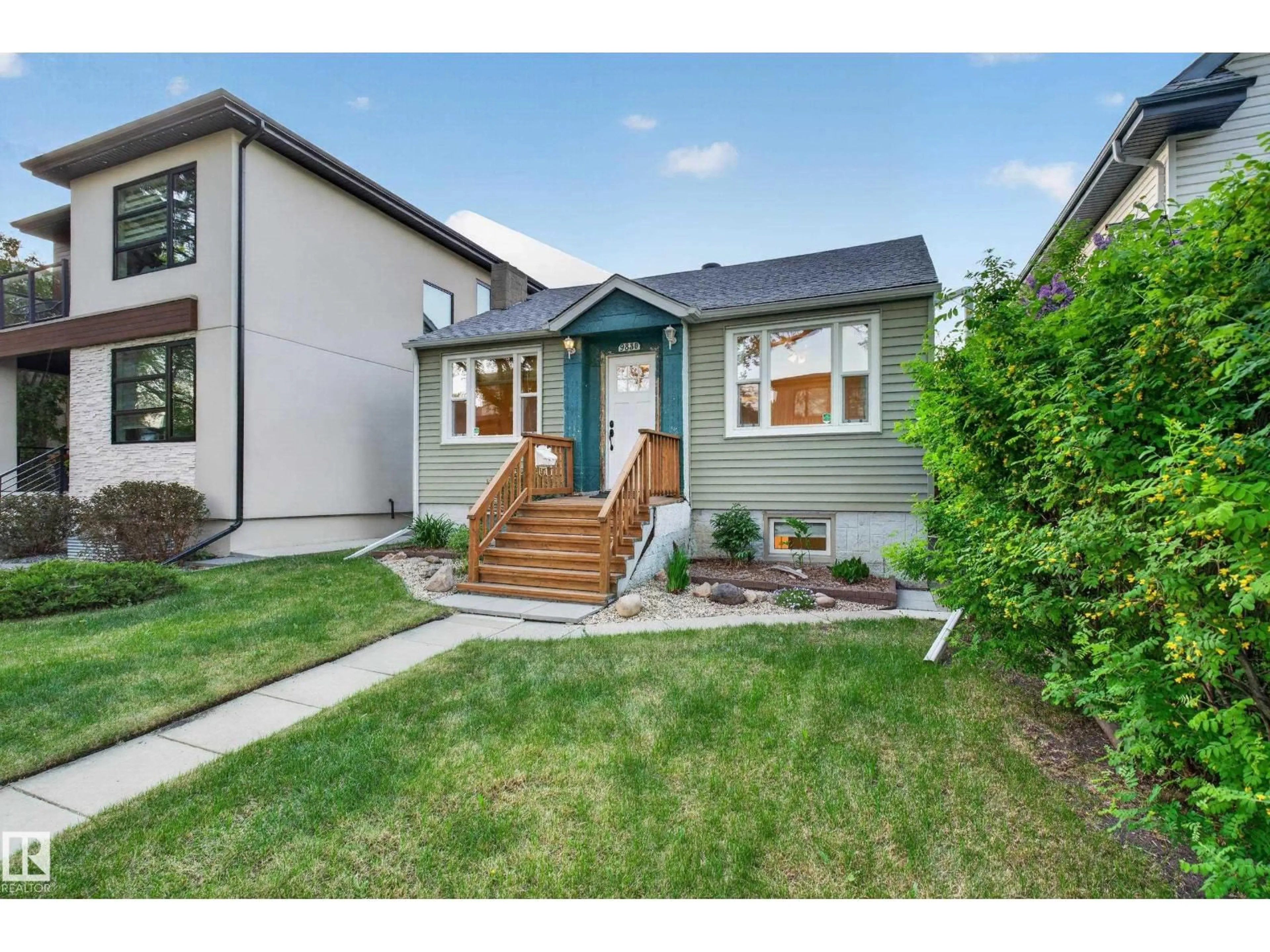 Home with vinyl exterior material, street for 9830 77 AV, Edmonton Alberta T6E1M4