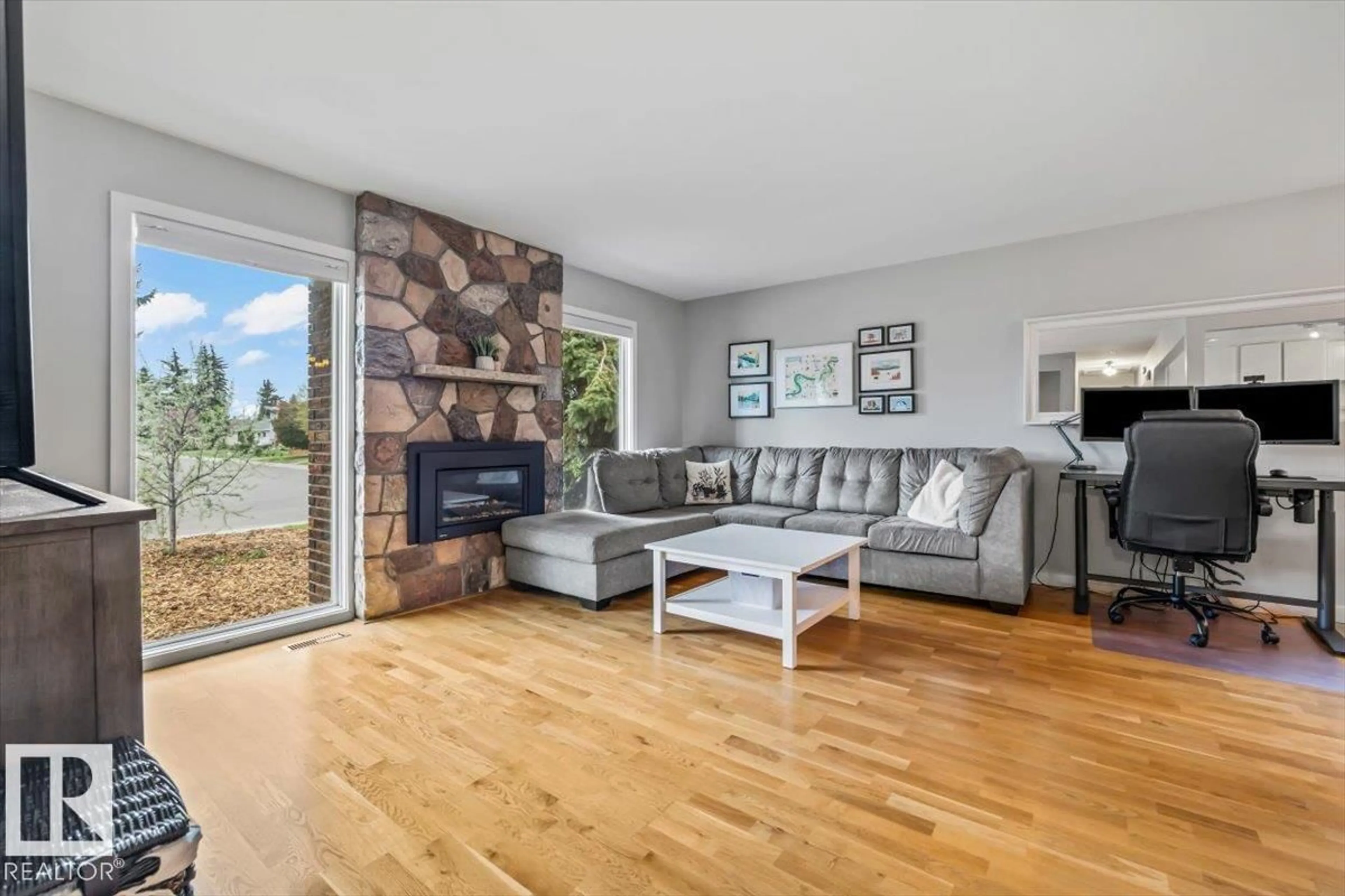 Living room with furniture, wood/laminate floor for 8523 143 ST, Edmonton Alberta T5K0N9