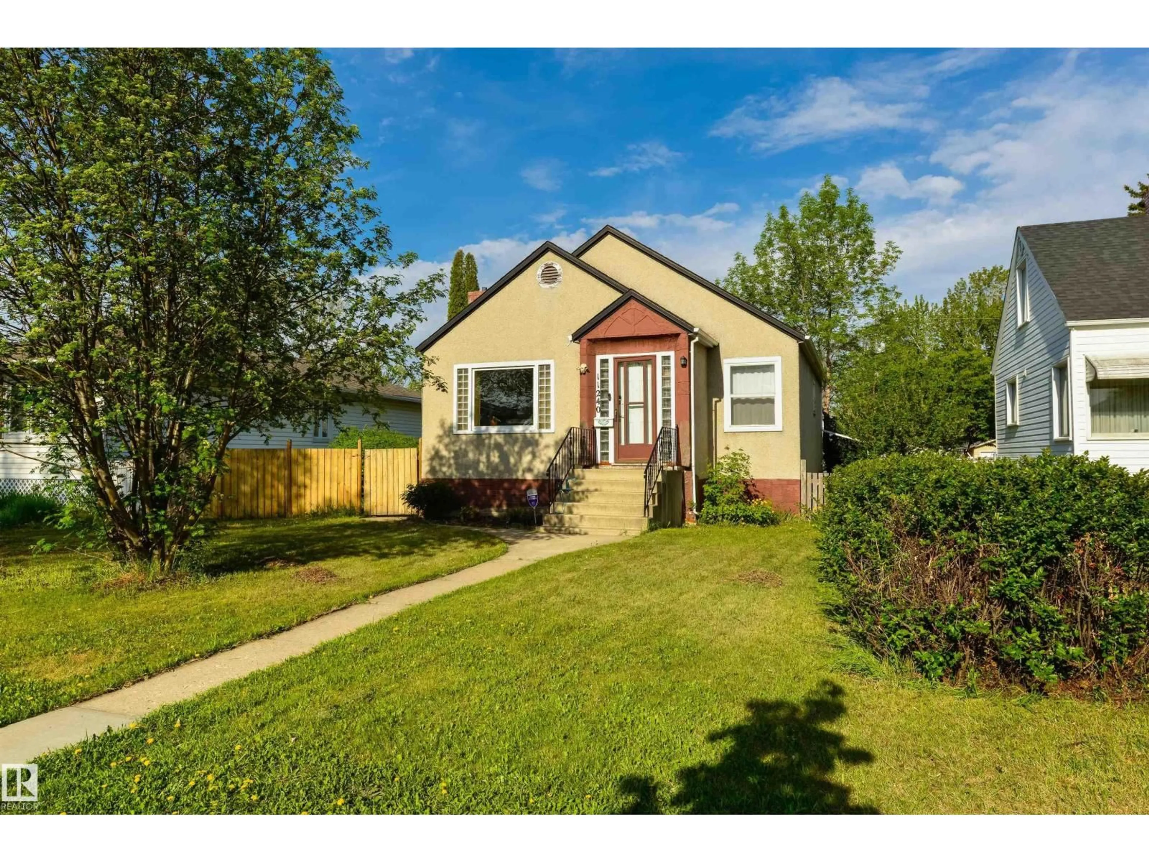 Home with vinyl exterior material, street for NW - 11240 102 ST, Edmonton Alberta T5G2E3