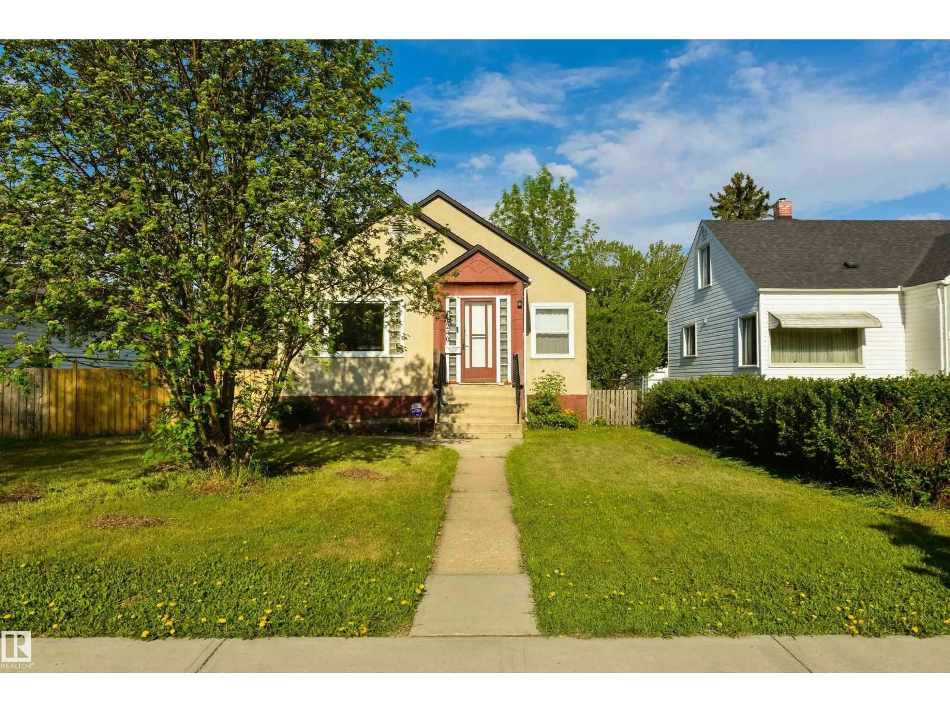 Home with vinyl exterior material, street for NW - 11240 102 ST, Edmonton Alberta T5G2E3