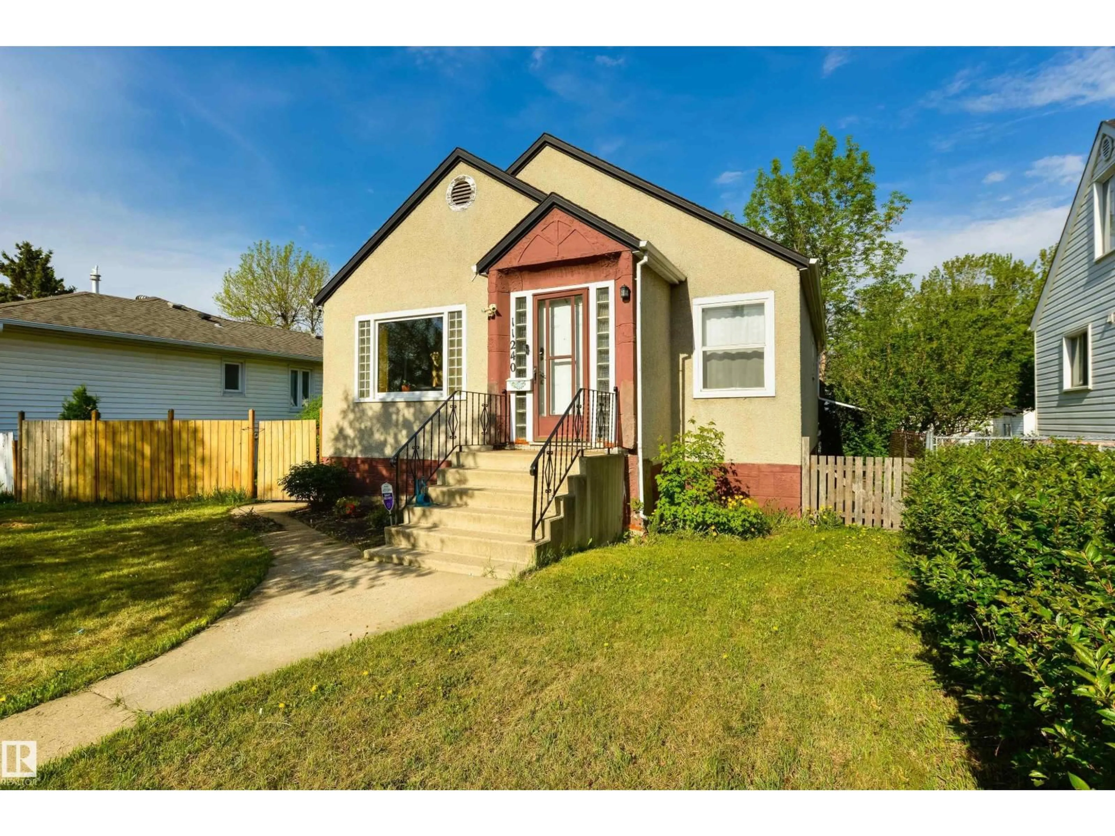 Home with vinyl exterior material, street for NW - 11240 102 ST, Edmonton Alberta T5G2E3