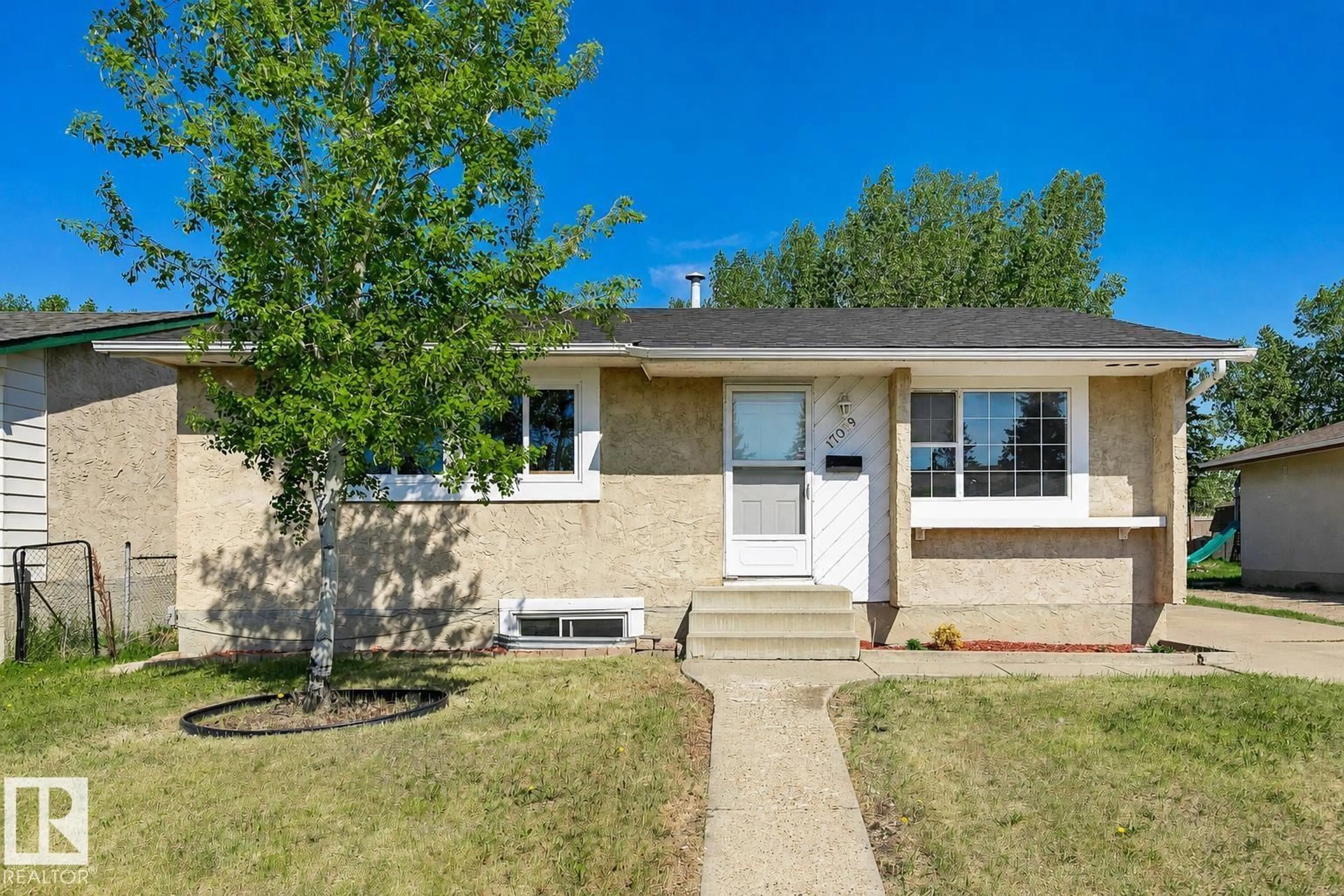 Home with vinyl exterior material, street for 17059 98 ST, Edmonton Alberta T5X3G5