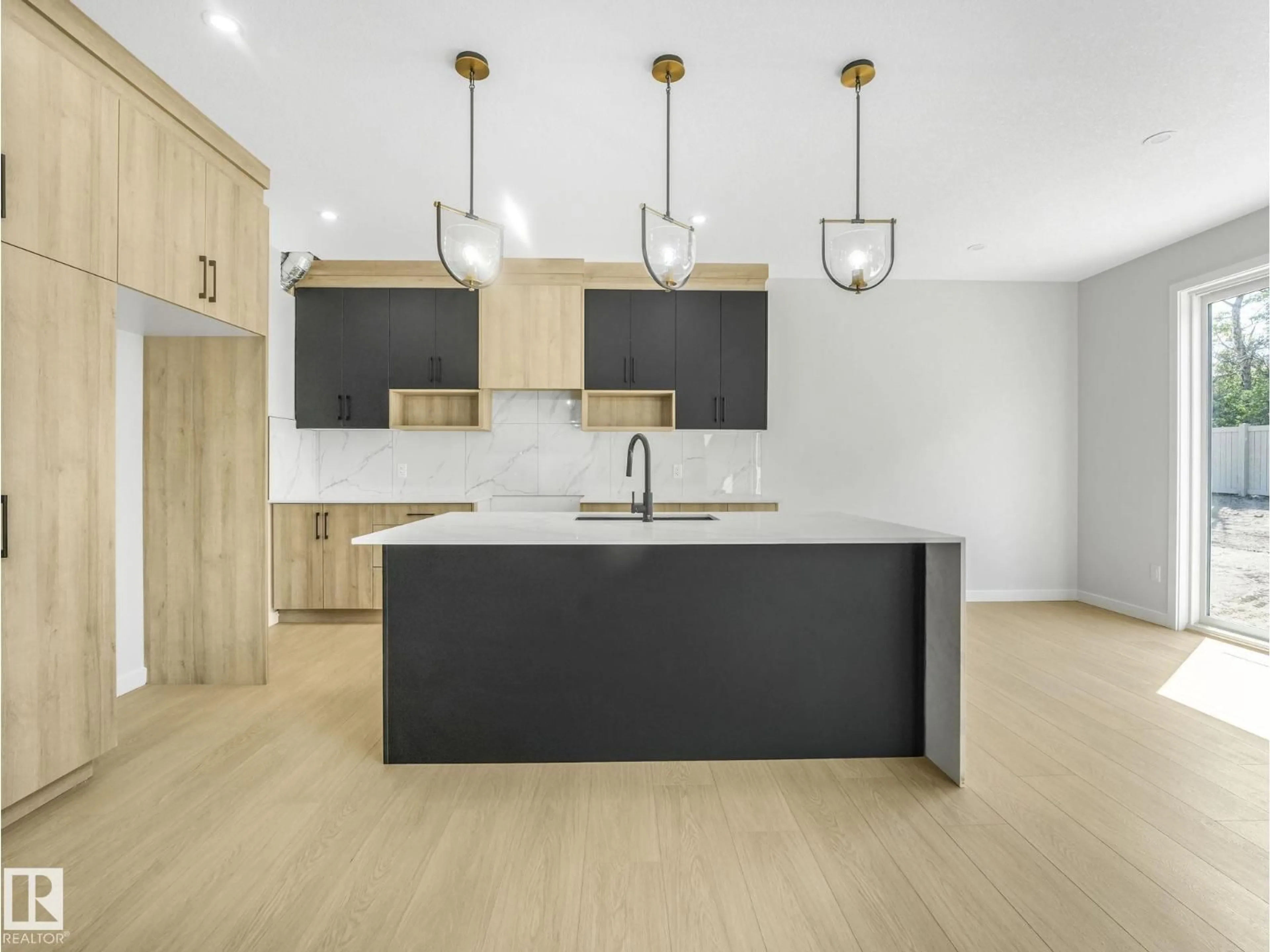 Open concept kitchen, wood/laminate floor for 1717 CROSSBILL LO, Edmonton Alberta T5S0V1