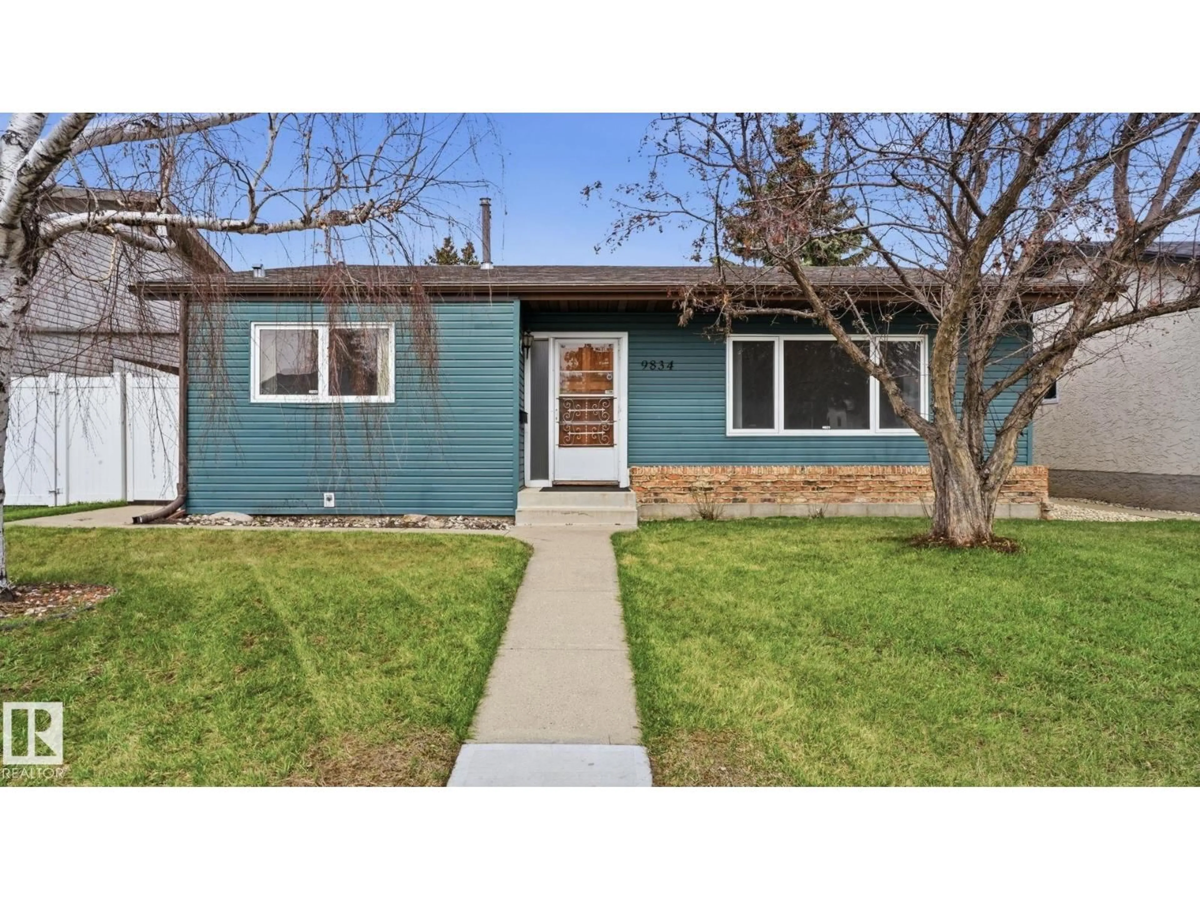 Home with vinyl exterior material, street for 9834 167A AV, Edmonton Alberta T5X2Z2