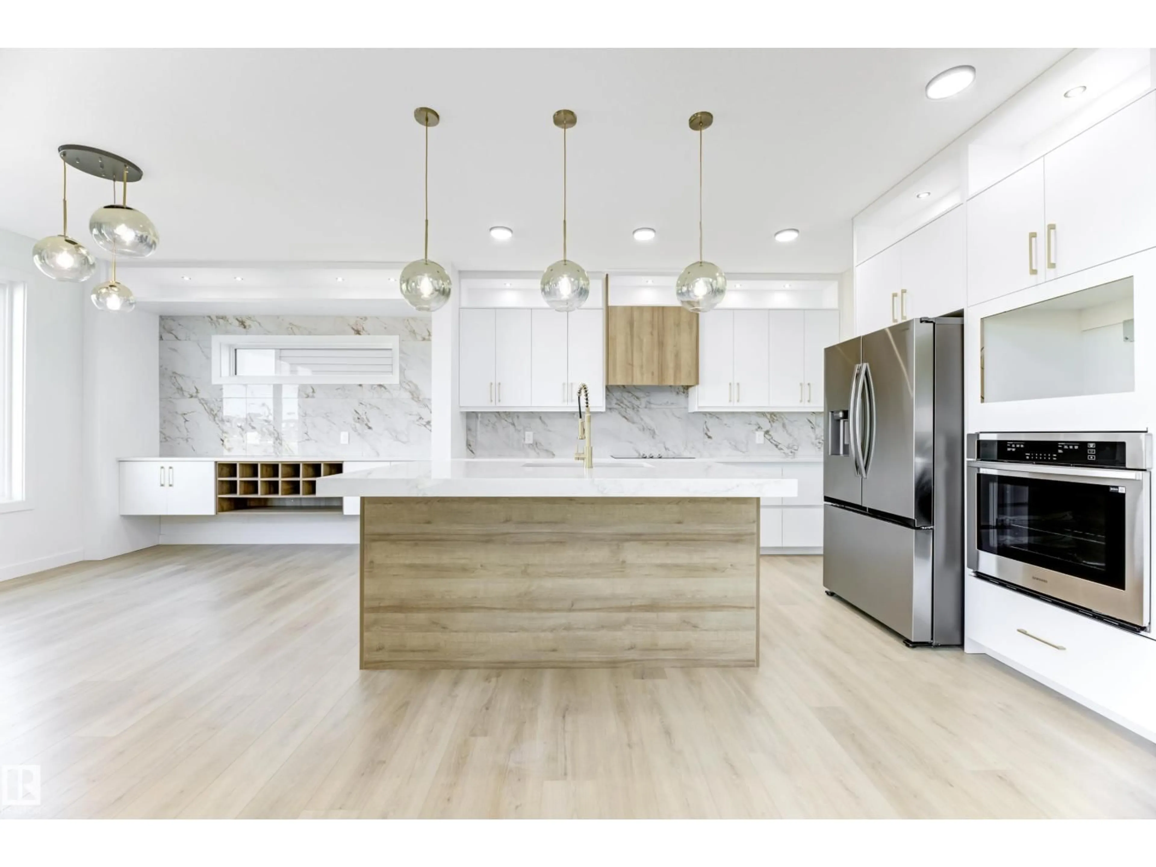Open concept kitchen, wood/laminate floor for 6 SOREL AV, Beaumont Alberta T4X2C9