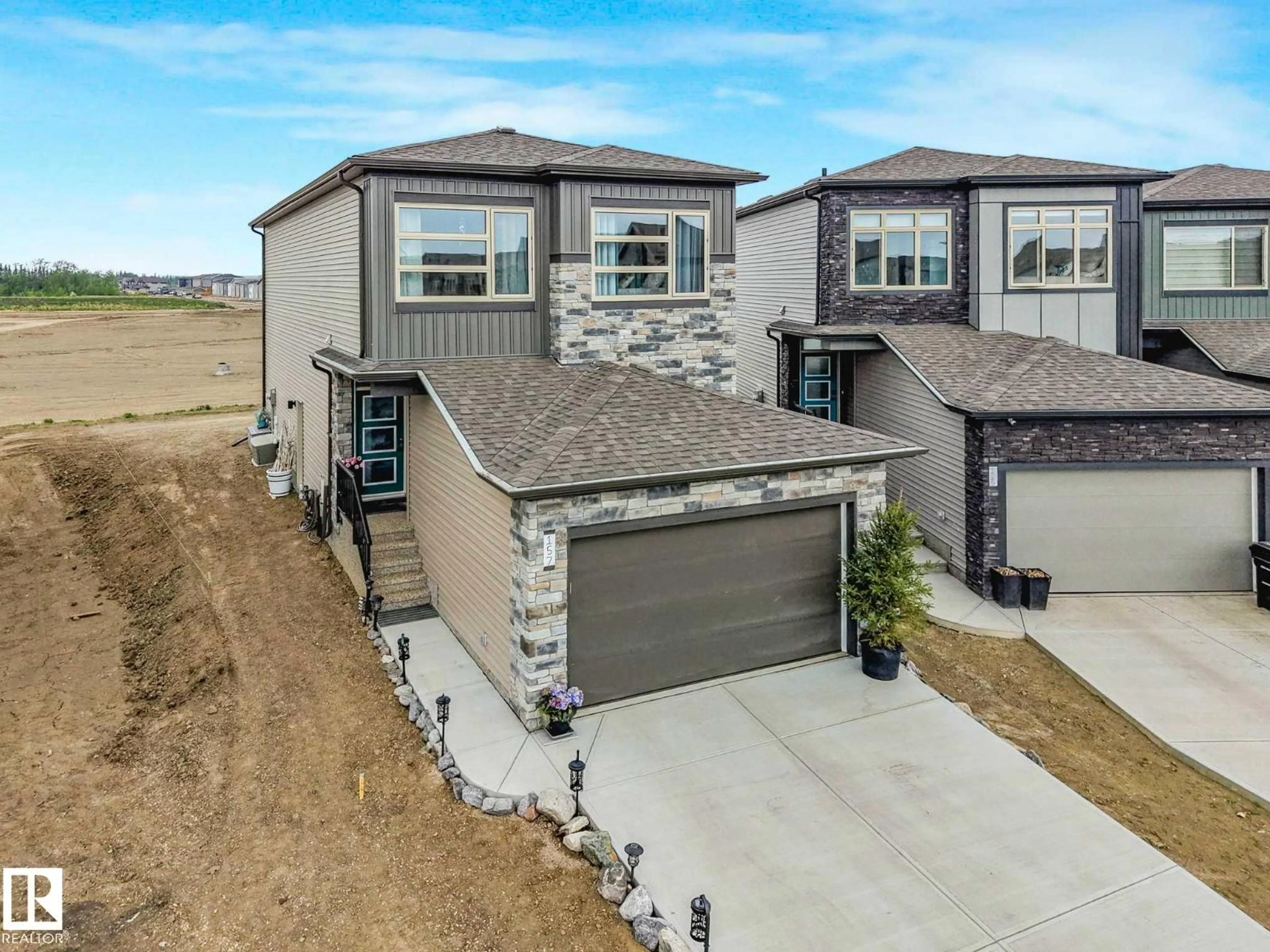 A pic from outside/outdoor area/front of a property/back of a property/a pic from drone, street for 157 GARNEAU GA, Spruce Grove Alberta T7X4E6