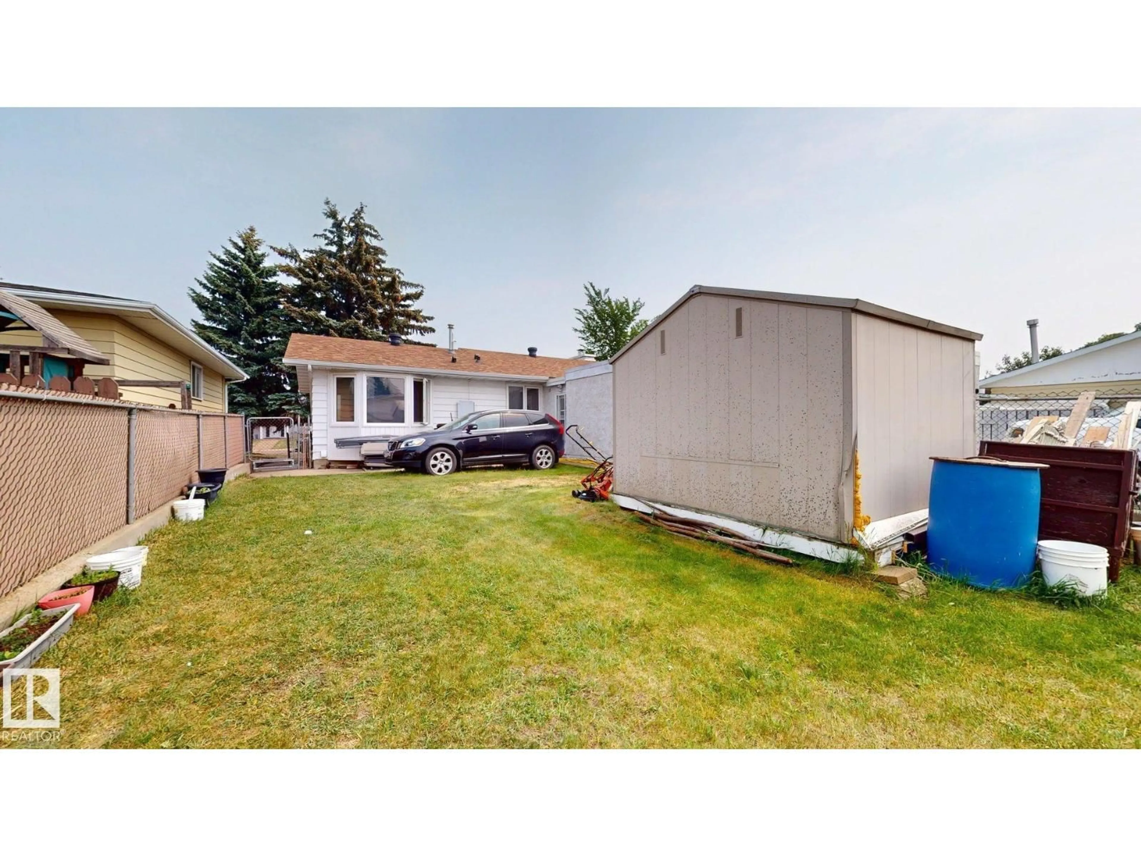 A pic from outside/outdoor area/front of a property/back of a property/a pic from drone, unknown for NW - 12812 45 ST, Edmonton Alberta T5A2K4
