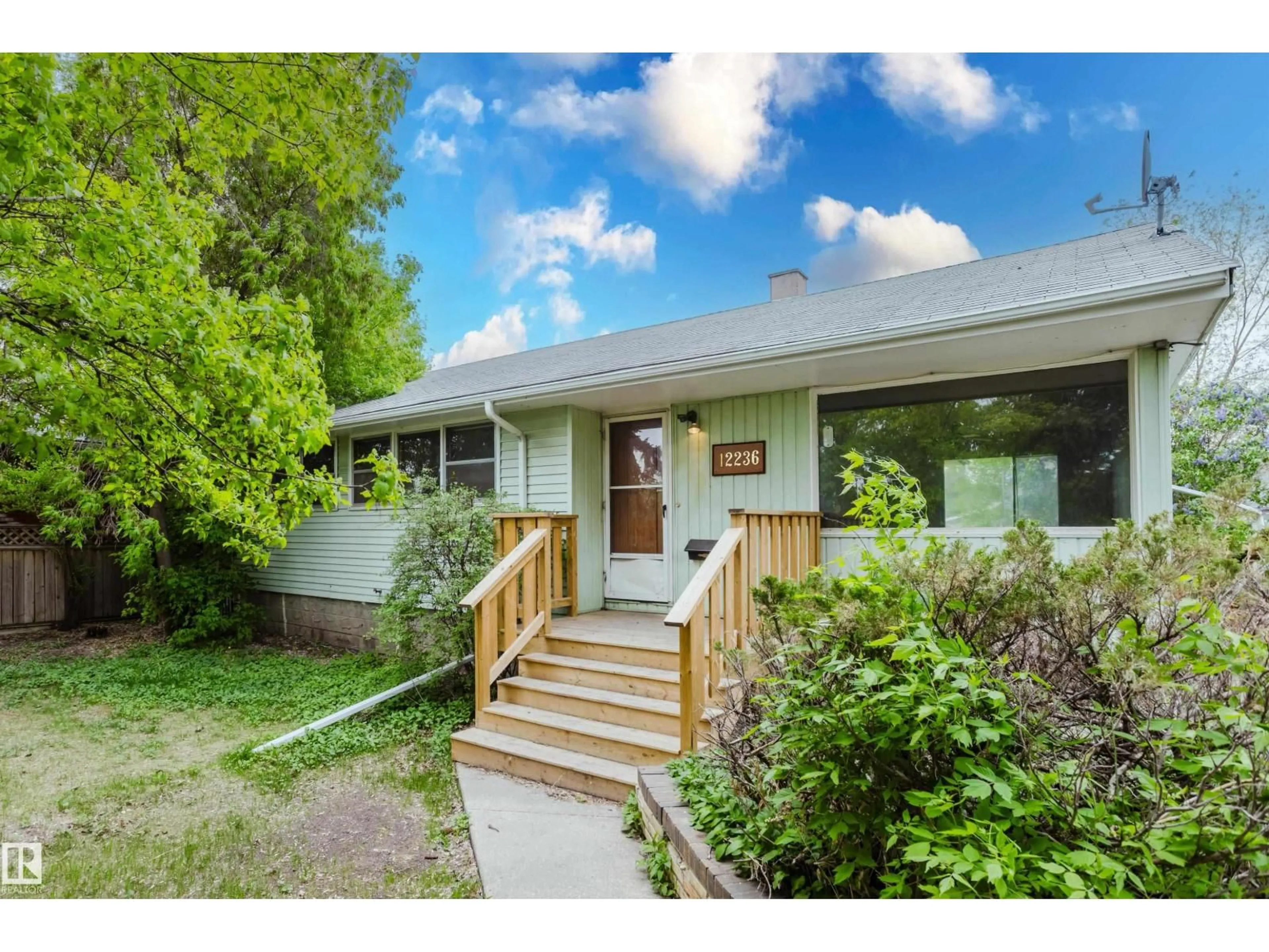 Home with vinyl exterior material, street for NW - 12236 131 ST, Edmonton Alberta T5L1M9