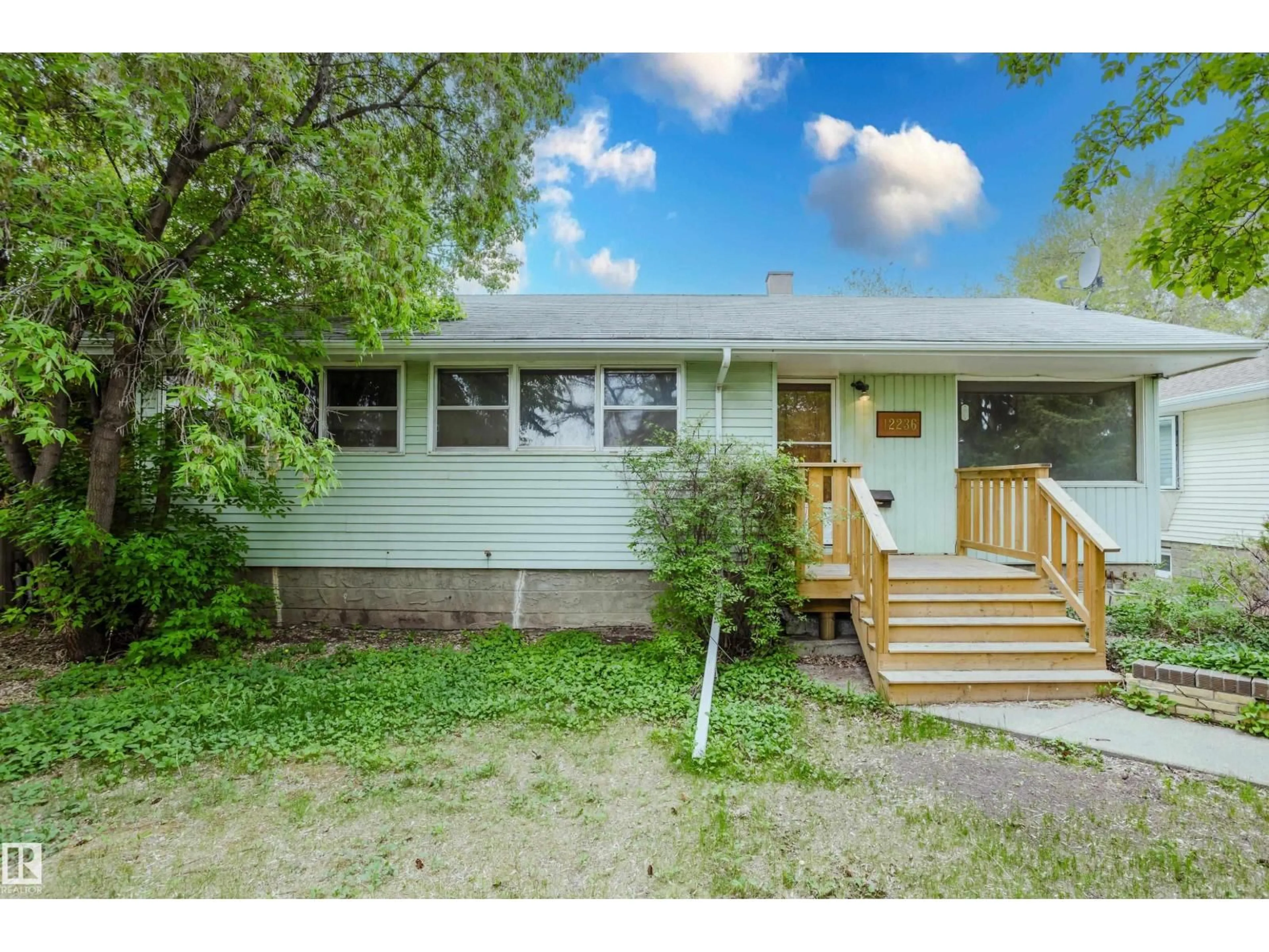 Home with vinyl exterior material, street for NW - 12236 131 ST, Edmonton Alberta T5L1M9