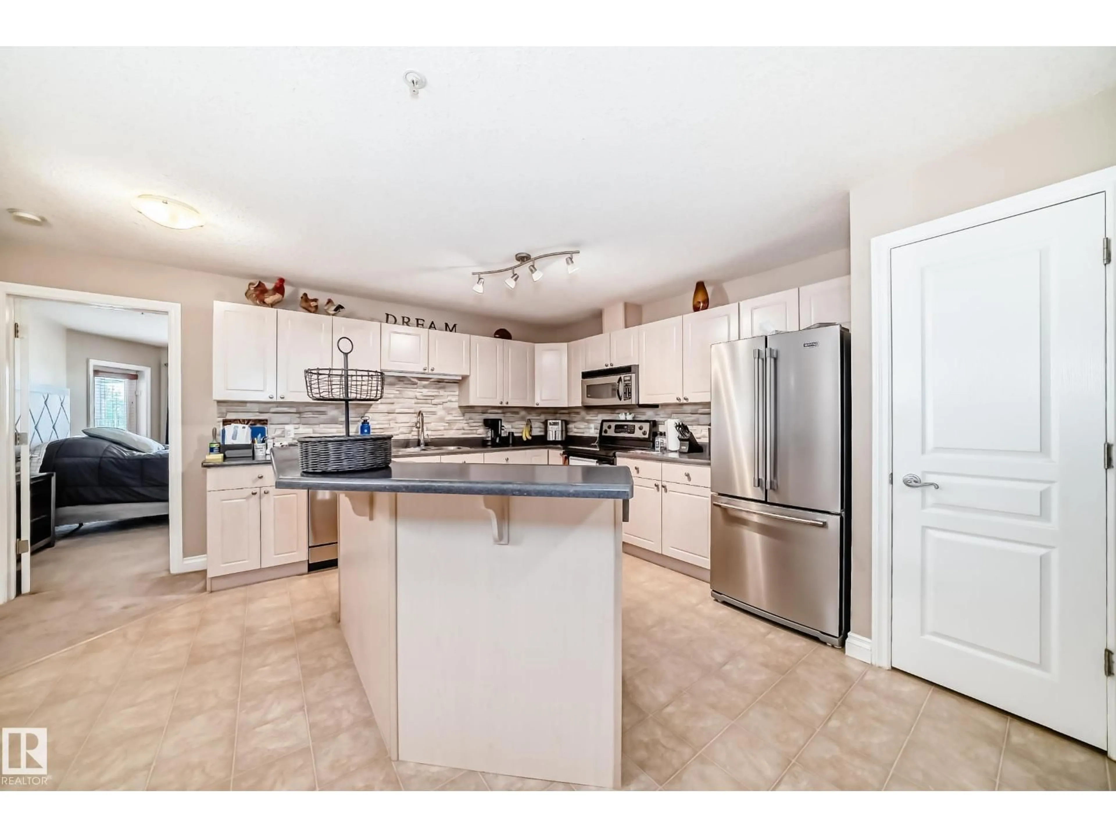 Open concept kitchen, ceramic/tile floor for 220 4312 139 AV NW, Edmonton Alberta T5Y3J4