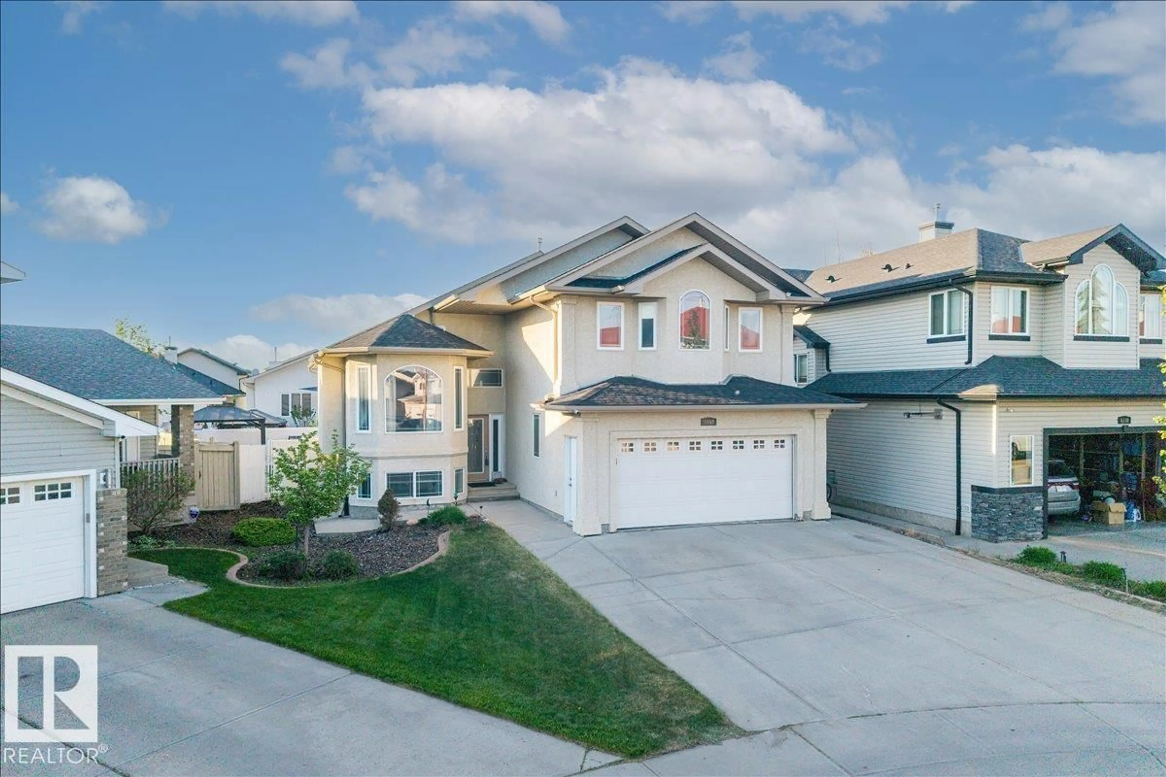 Home with vinyl exterior material, street for 6050 164A AV, Edmonton Alberta T5Y0A7