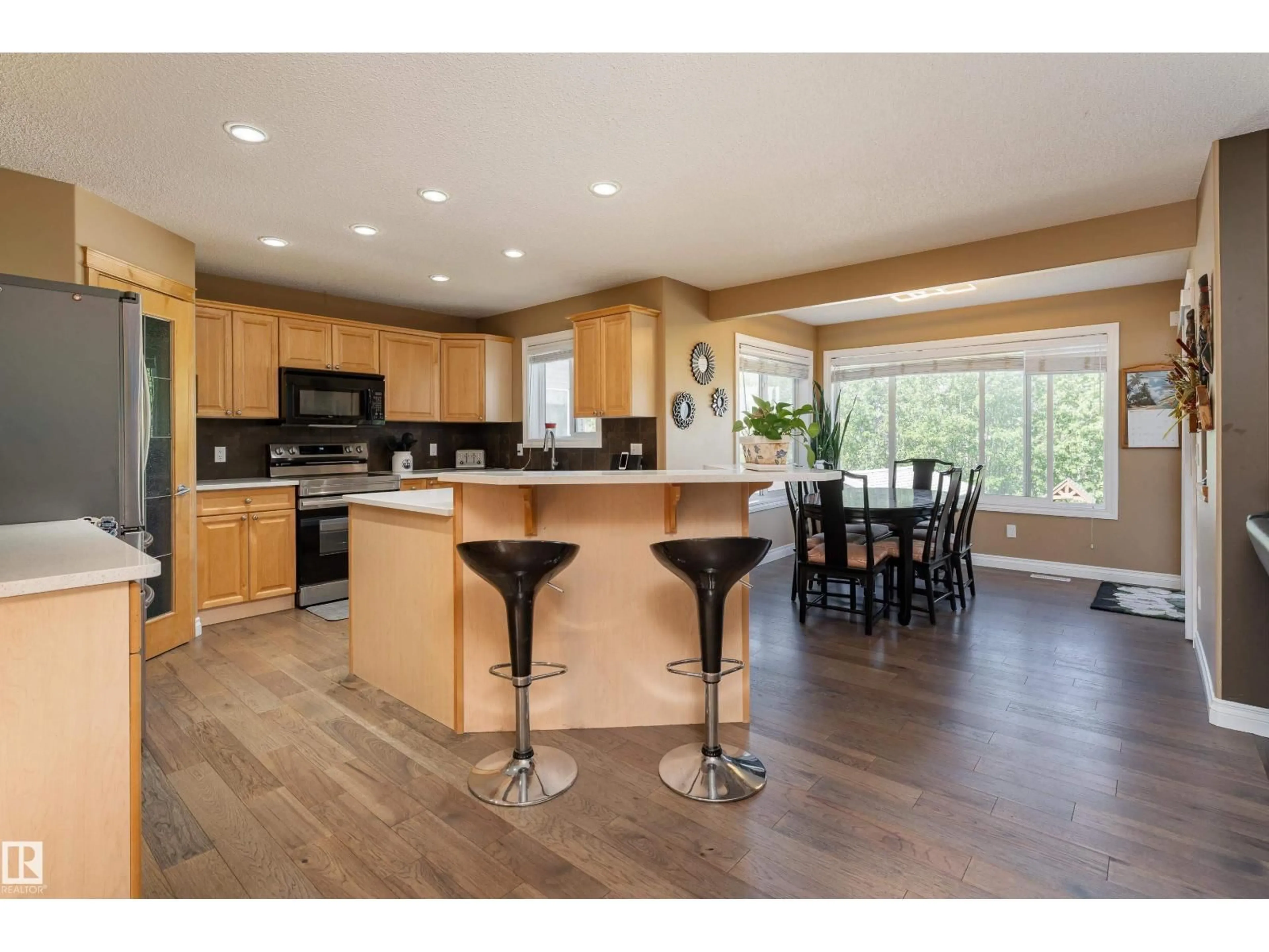 Open concept kitchen, wood/laminate floor for 5108 63 ST, Beaumont Alberta T4X1V4